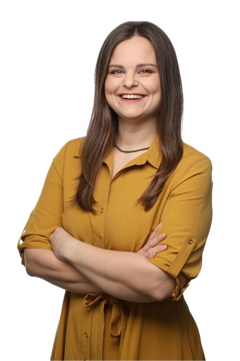 Tara crosses her arms in a yellow dress