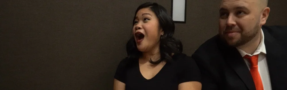 Event guests reacting in amazement to a mind-reading moment by mentalist Fred Berthelot