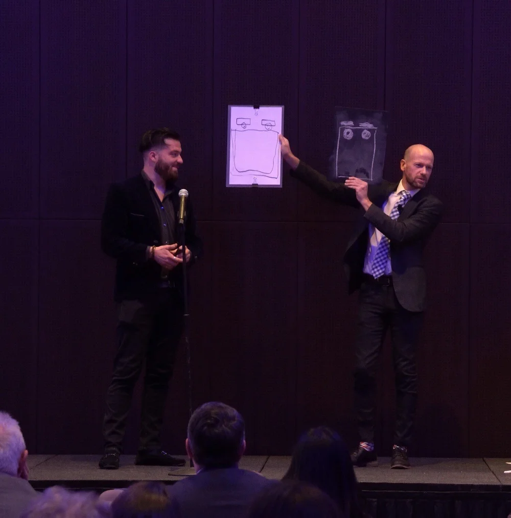 Mentalist Fred Berthelot, Architect of the Mind, entertains corporate crowd at a company holiday party.
