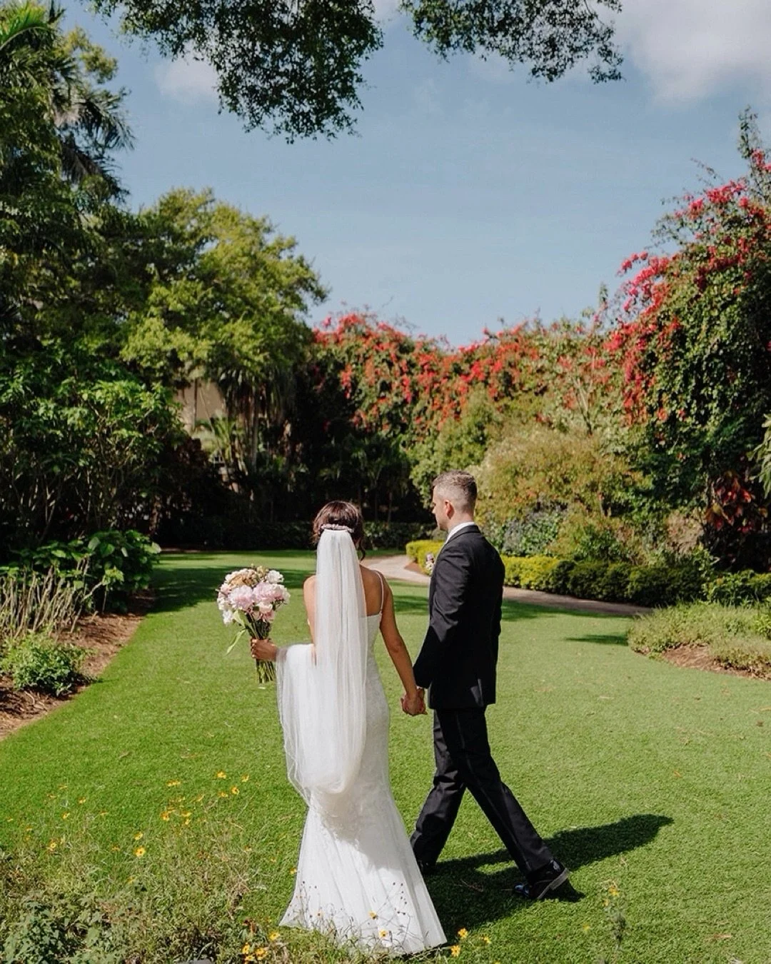 There&rsquo;s something magical about a Sunken Gardens elopement. Bright flowers everywhere, soft Florida light, and a love story unfolding in the middle of it all. @sunkengardensstpete 
#SunkenGardensWedding #StPeteWedding #FloridaWeddingPhotographe