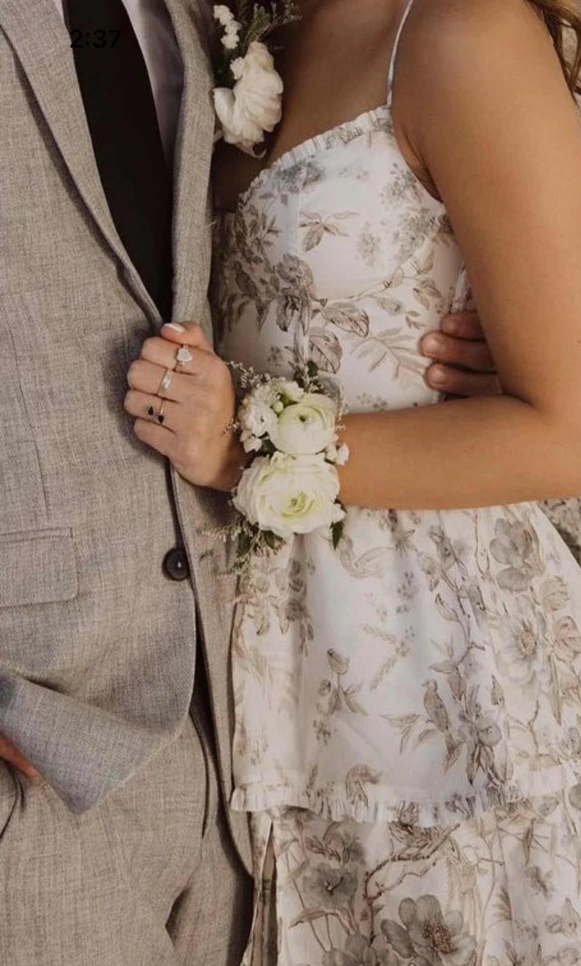 couple with white flora wrist corsage ready for school dance