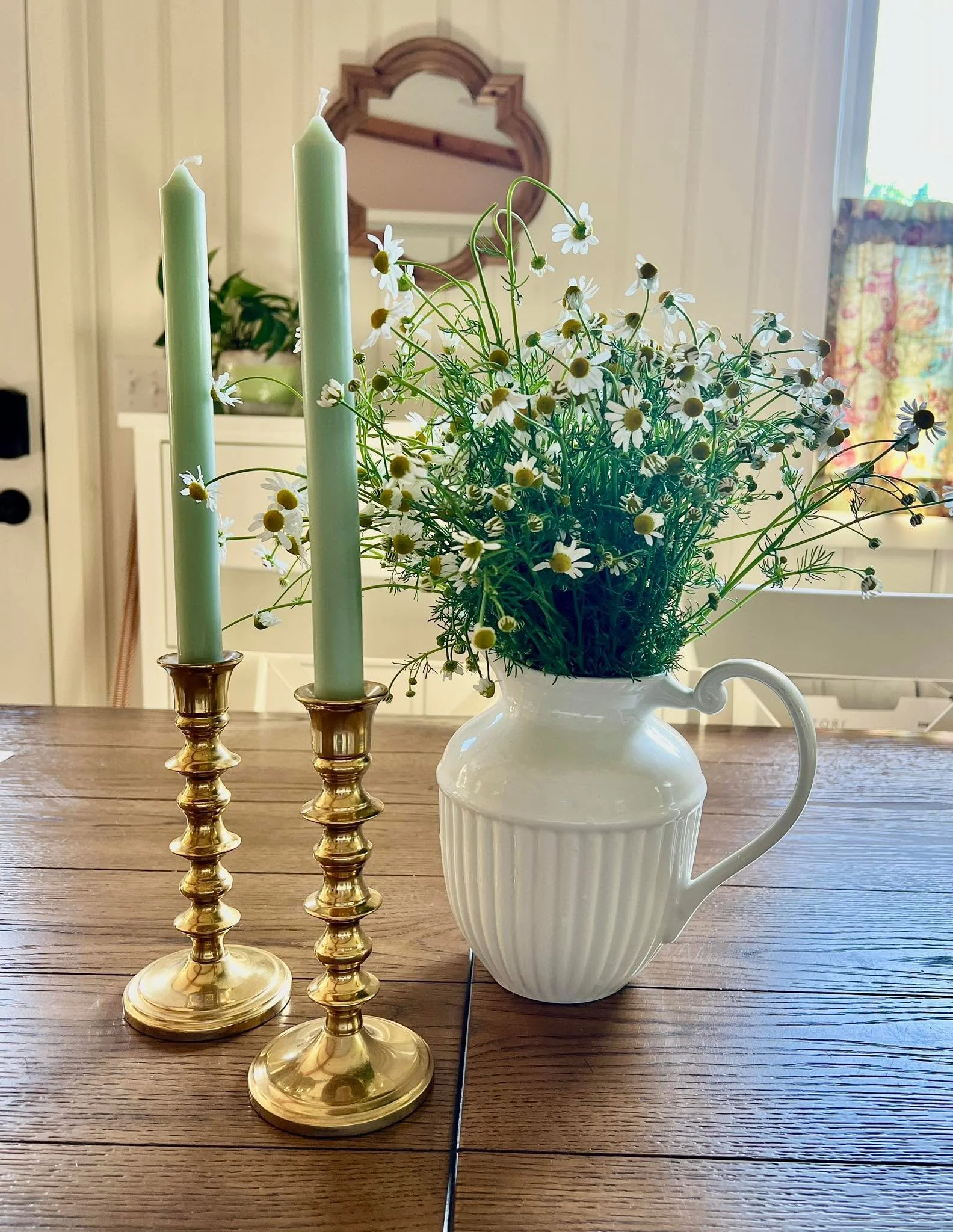 Home decor doesn&rsquo;t have to cost a lot to make your home feel special.  This grouping cost me $19.  I thrifted the brass candlesticks and pitcher, candles were on a clearance sale and the flowers were cut from my herb garden. What&rsquo;s makes 