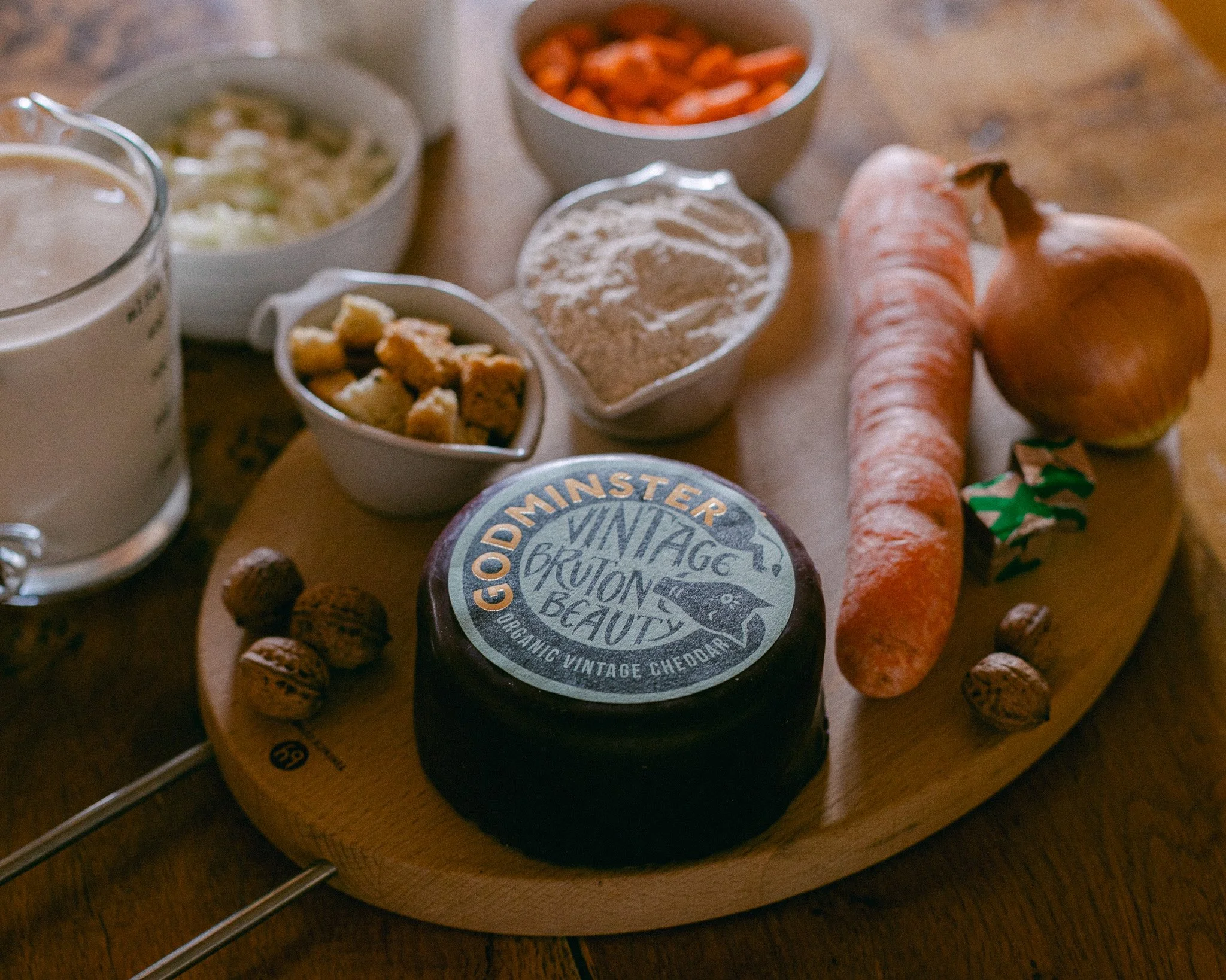 Godminster Vintage Cheddar Bruton, Arranged with ingredients ready to cook a cheddar cheese soup