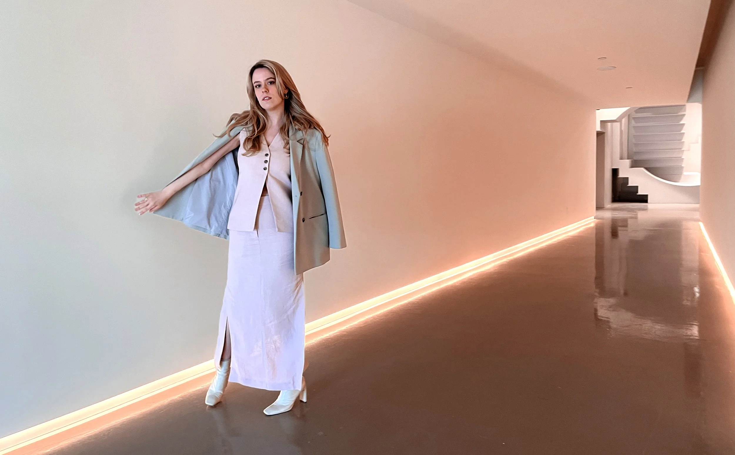 Amy Thompson in R:DESIGN's front hallway