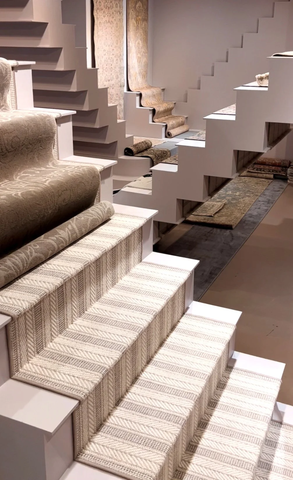 Photo of the M.C. Escher inspired stair-runner installation in the R:DESIGN showroom