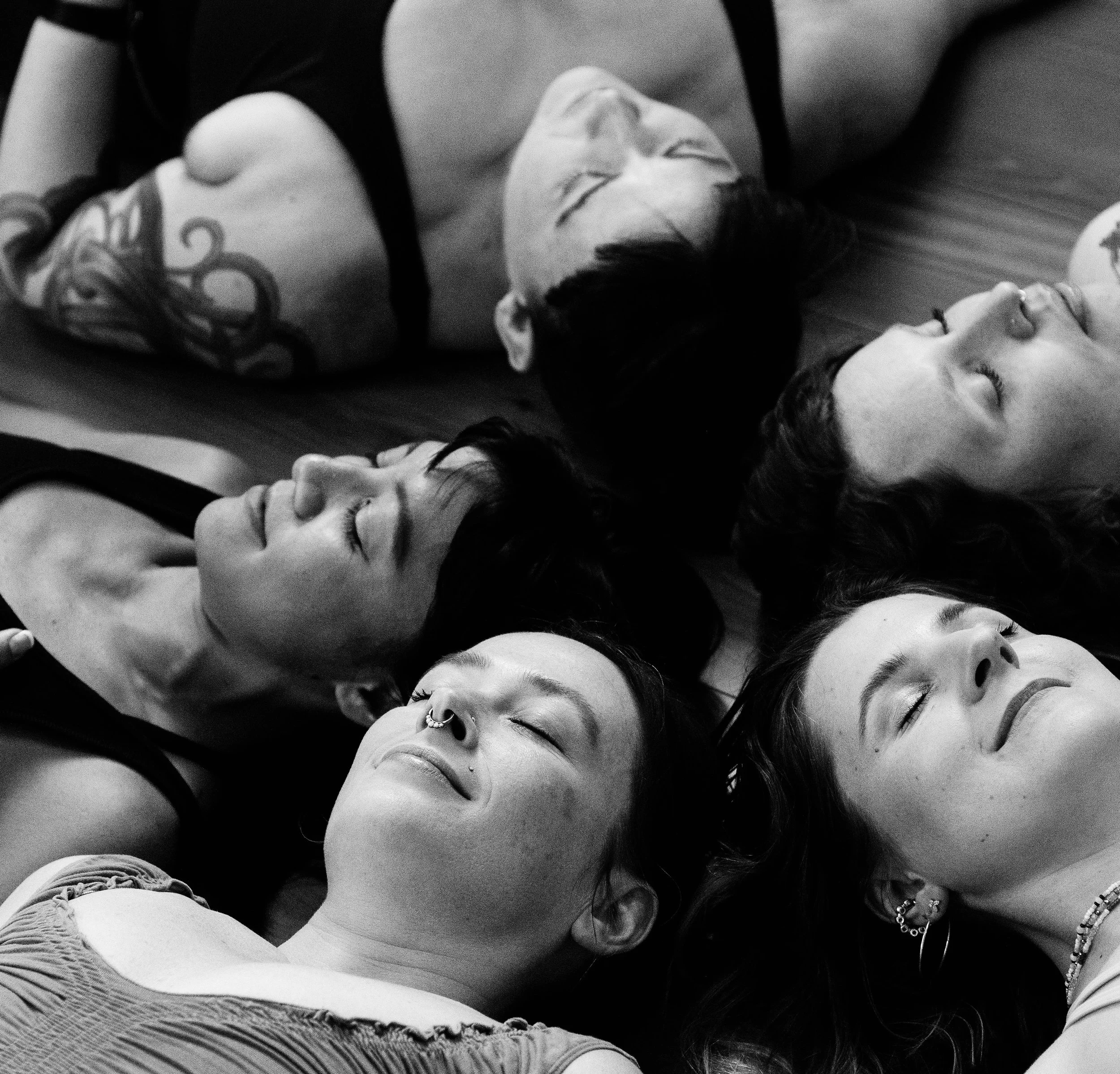 Yogis lying on the floor at Full Bodied Yoga