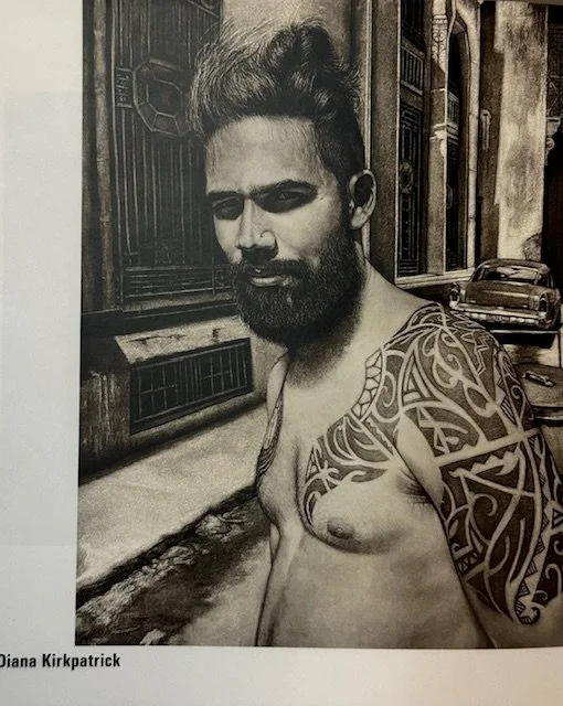 A detailed black and white drawing of a shirtless man with a beard and a tribal tattoo on his arm, standing on a street with a vintage car in the background.