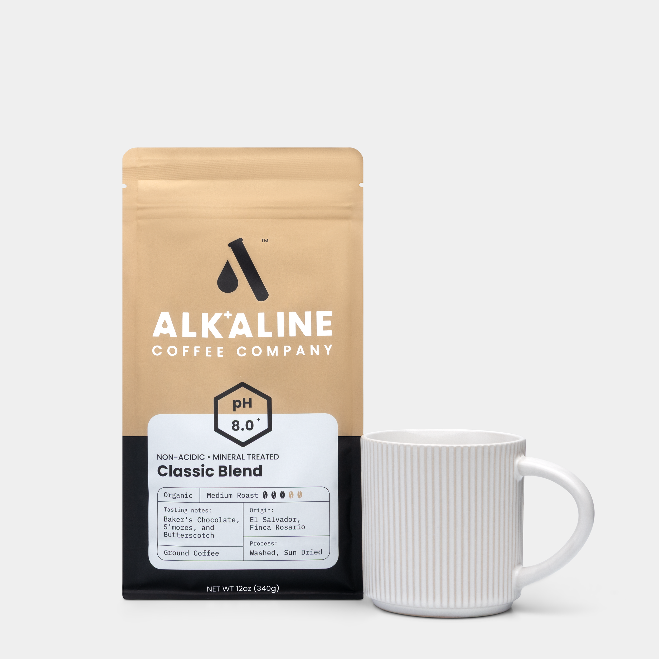 Alkaline 1x1 Crops_Bags_Front w_ Coffee cup.png