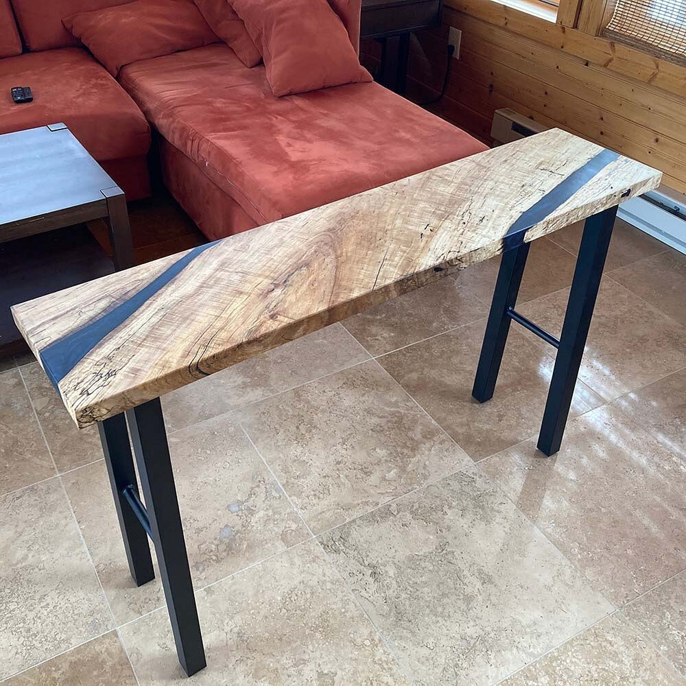 Console Table with Jake

Jake and I each bought amazing Spalted Curly Maple Slabs. For our first project using the slabs, we used a cut-off to make a console table with epoxy.

Jake removed the bark,  cleaned the edges and planed the slabs flat befor