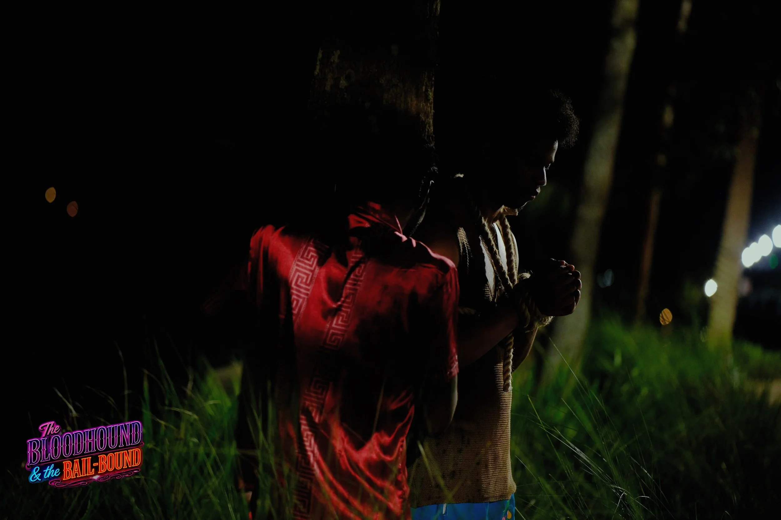 A frame from the original streaming TV series THE BLOODHOUND & THE BAIL-BOUND (2026) by Filmmaker Lazarus X.  © 2027 The Lazarus X Archives for Media, Rights & Masters LLC. All Rights Reserved.