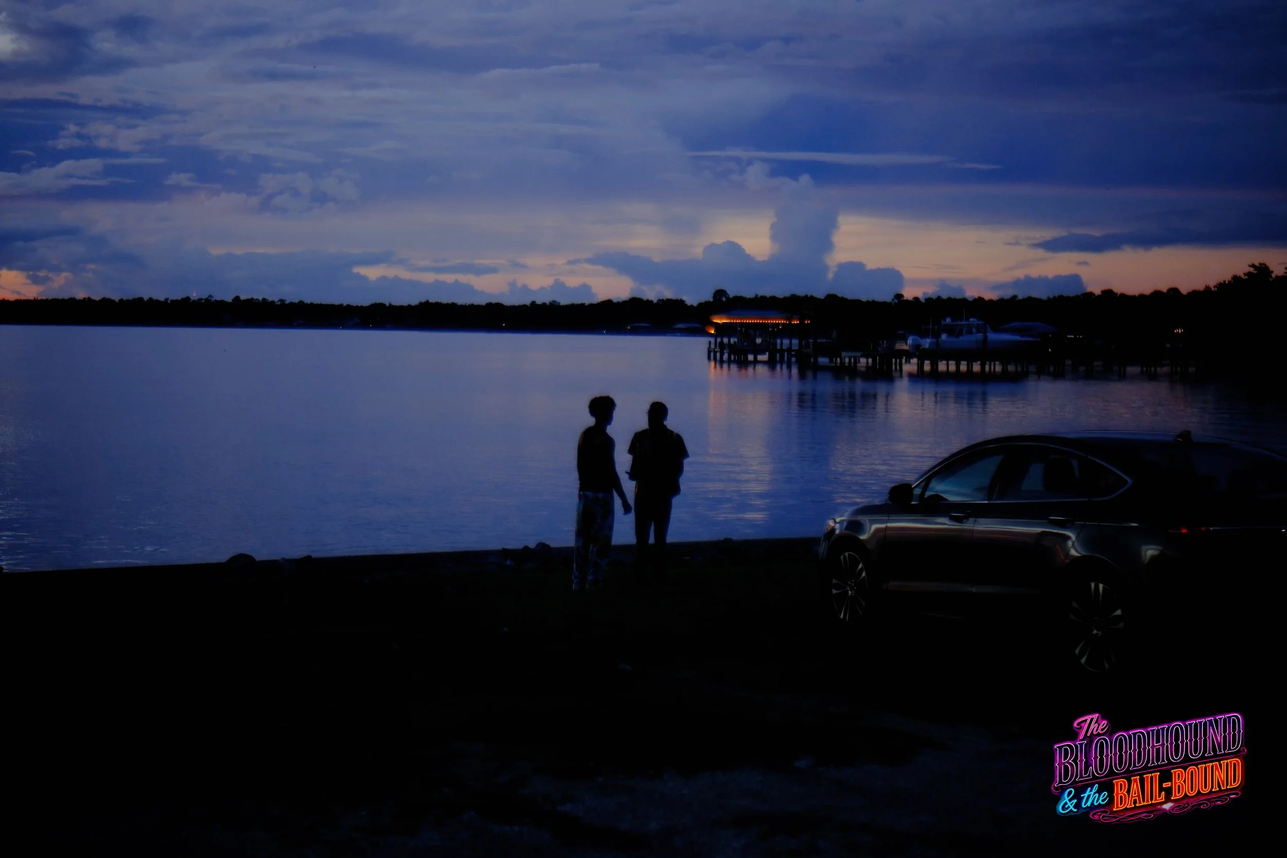 A frame from the original streaming TV series THE BLOODHOUND & THE BAIL-BOUND (2026) by Filmmaker Lazarus X.  © 2027 The Lazarus X Archives for Media, Rights & Masters LLC. All Rights Reserved.