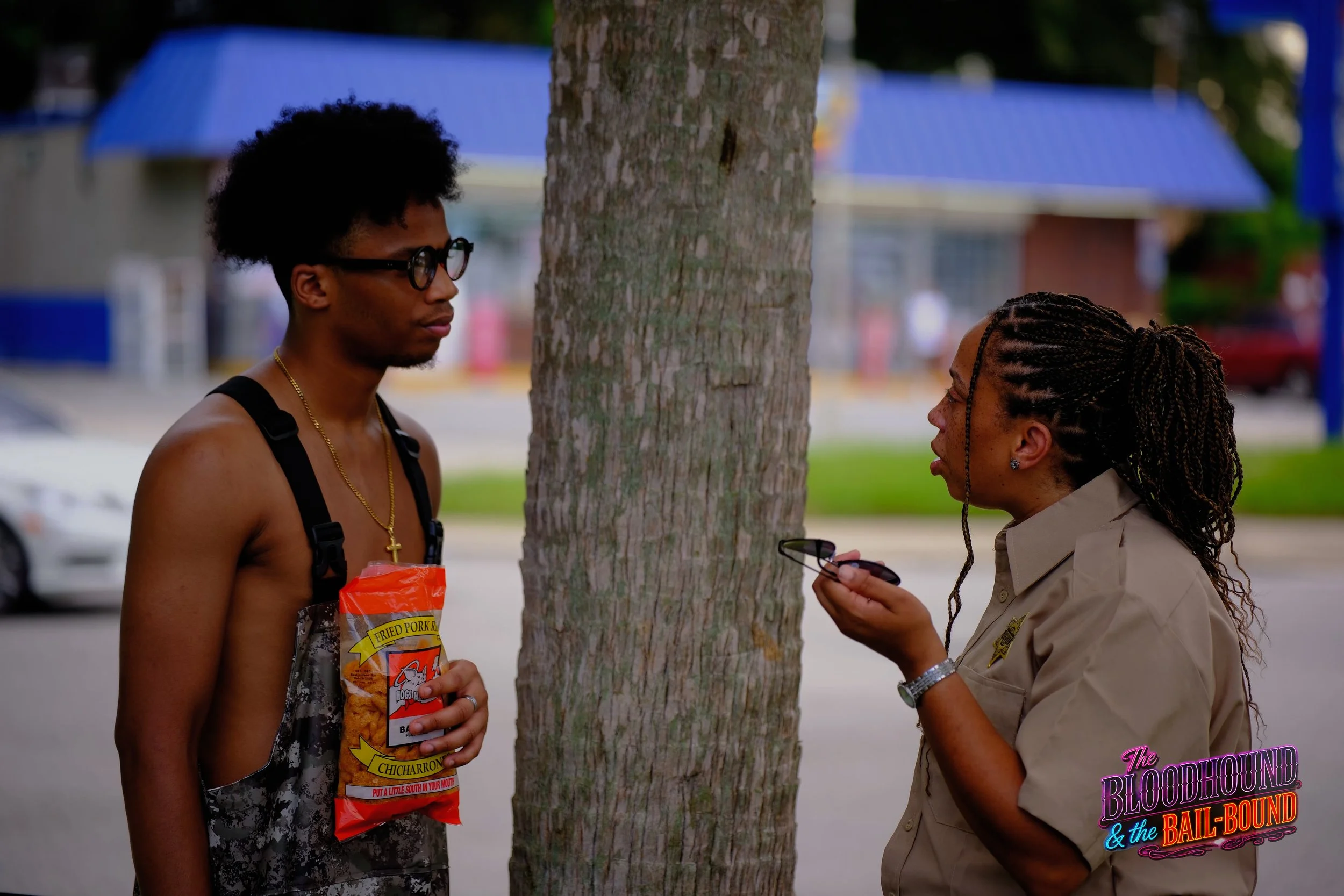 A frame from the original streaming TV series THE BLOODHOUND & THE BAIL-BOUND (2026) by Filmmaker Lazarus X.  © 2027 The Lazarus X Archives for Media, Rights & Masters LLC. All Rights Reserved.