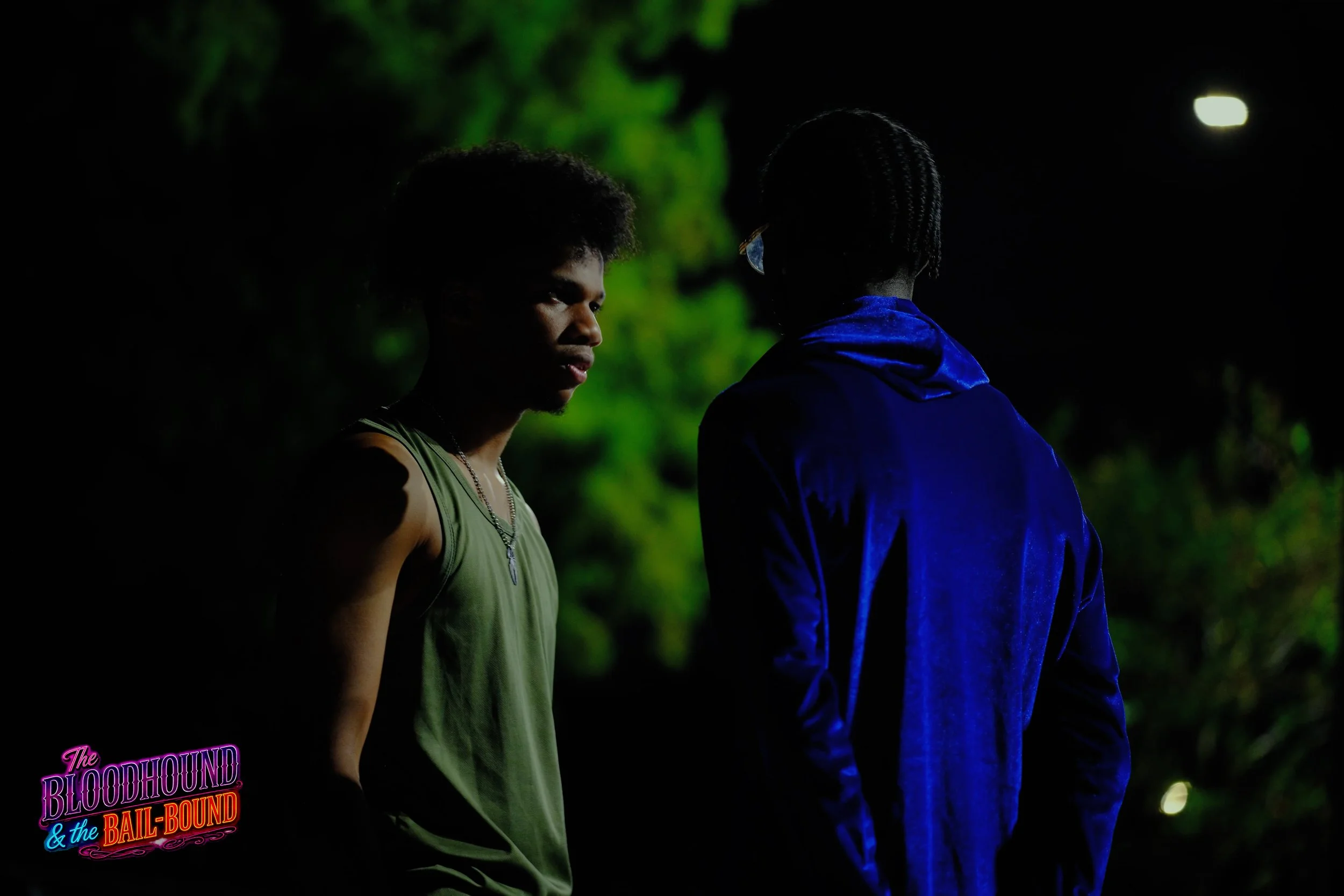 A frame from the original streaming TV series THE BLOODHOUND & THE BAIL-BOUND (2026) by Filmmaker Lazarus X.  © 2027 The Lazarus X Archives for Media, Rights & Masters LLC. All Rights Reserved.