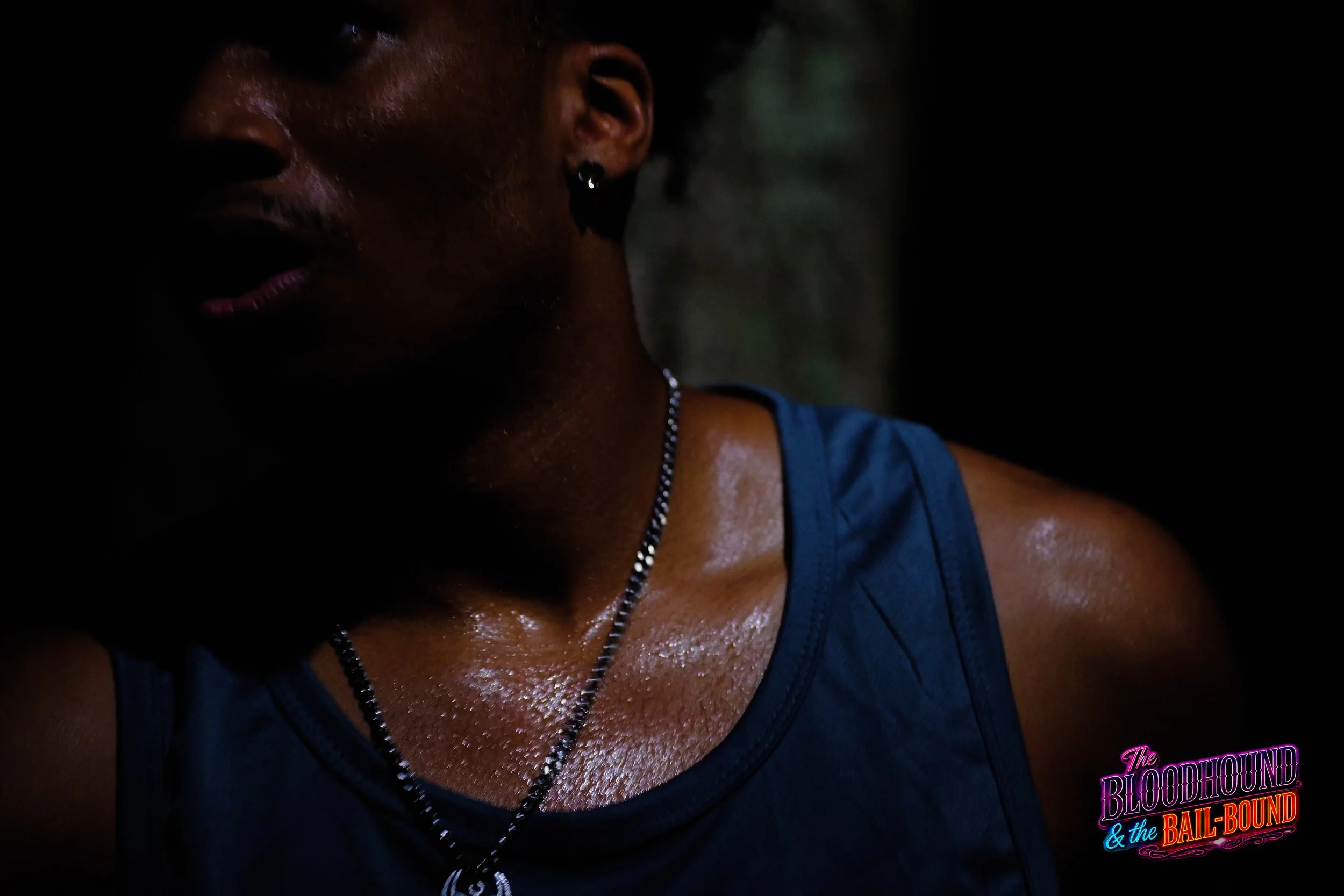 A frame from the original streaming TV series THE BLOODHOUND & THE BAIL-BOUND (2026) by Filmmaker Lazarus X.  © 2027 The Lazarus X Archives for Media, Rights & Masters LLC. All Rights Reserved.