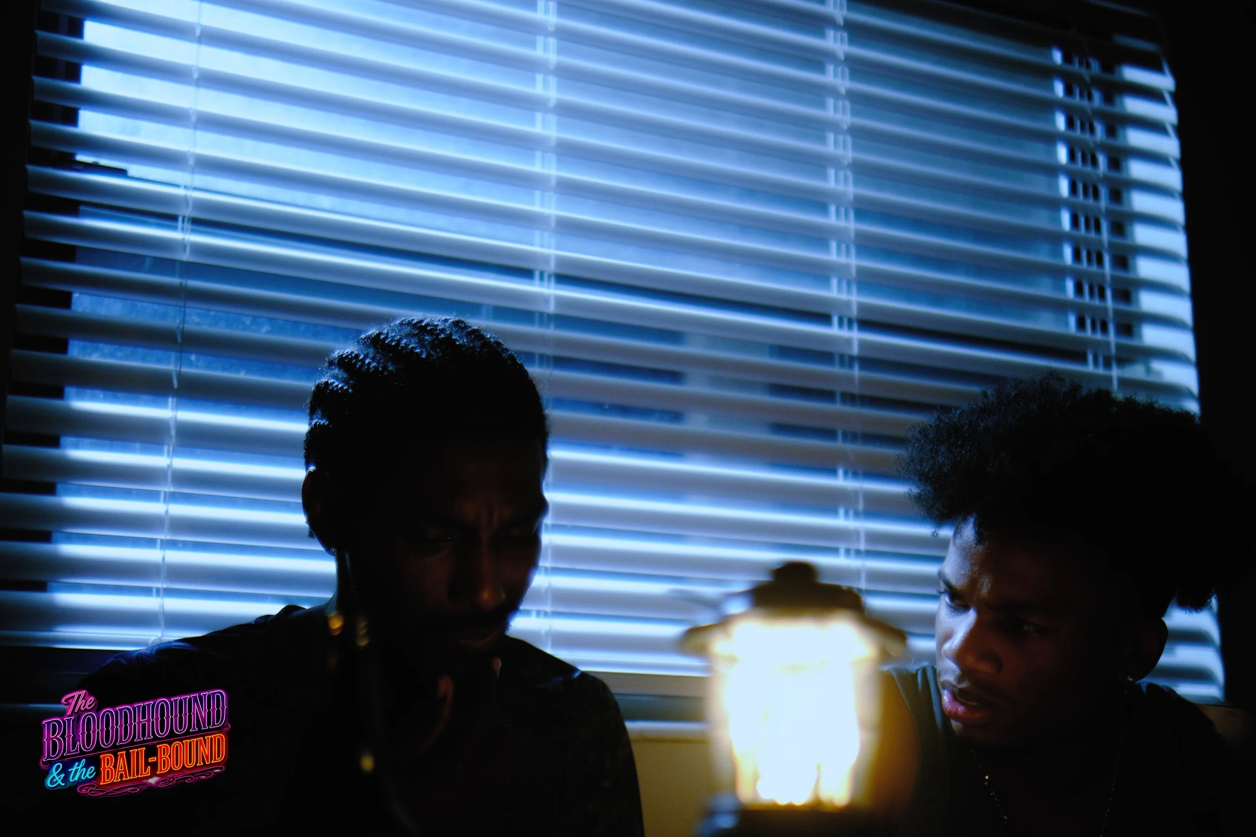 A frame from the original streaming TV series THE BLOODHOUND & THE BAIL-BOUND (2026) by Filmmaker Lazarus X.  © 2027 The Lazarus X Archives for Media, Rights & Masters LLC. All Rights Reserved.