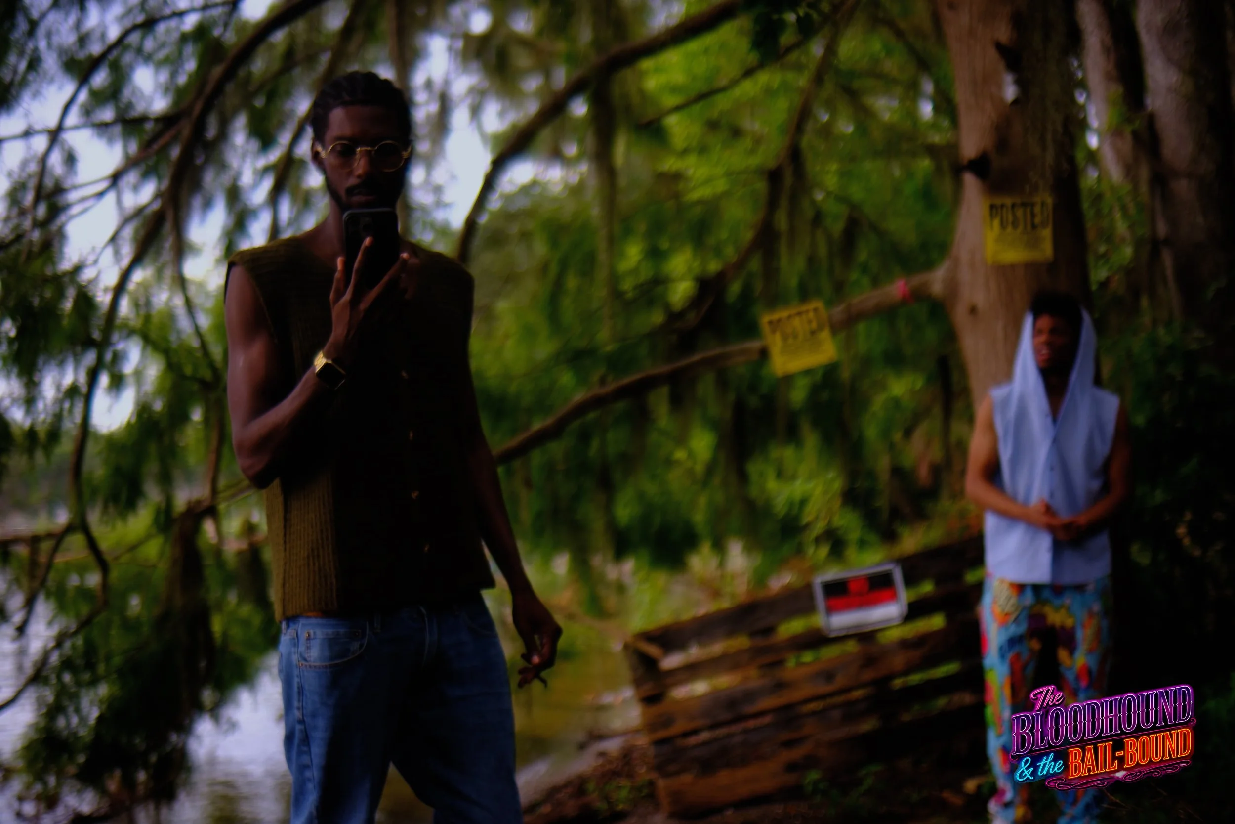 A frame from the original streaming TV series THE BLOODHOUND & THE BAIL-BOUND (2026) by Filmmaker Lazarus X.  © 2027 The Lazarus X Archives for Media, Rights & Masters LLC. All Rights Reserved.