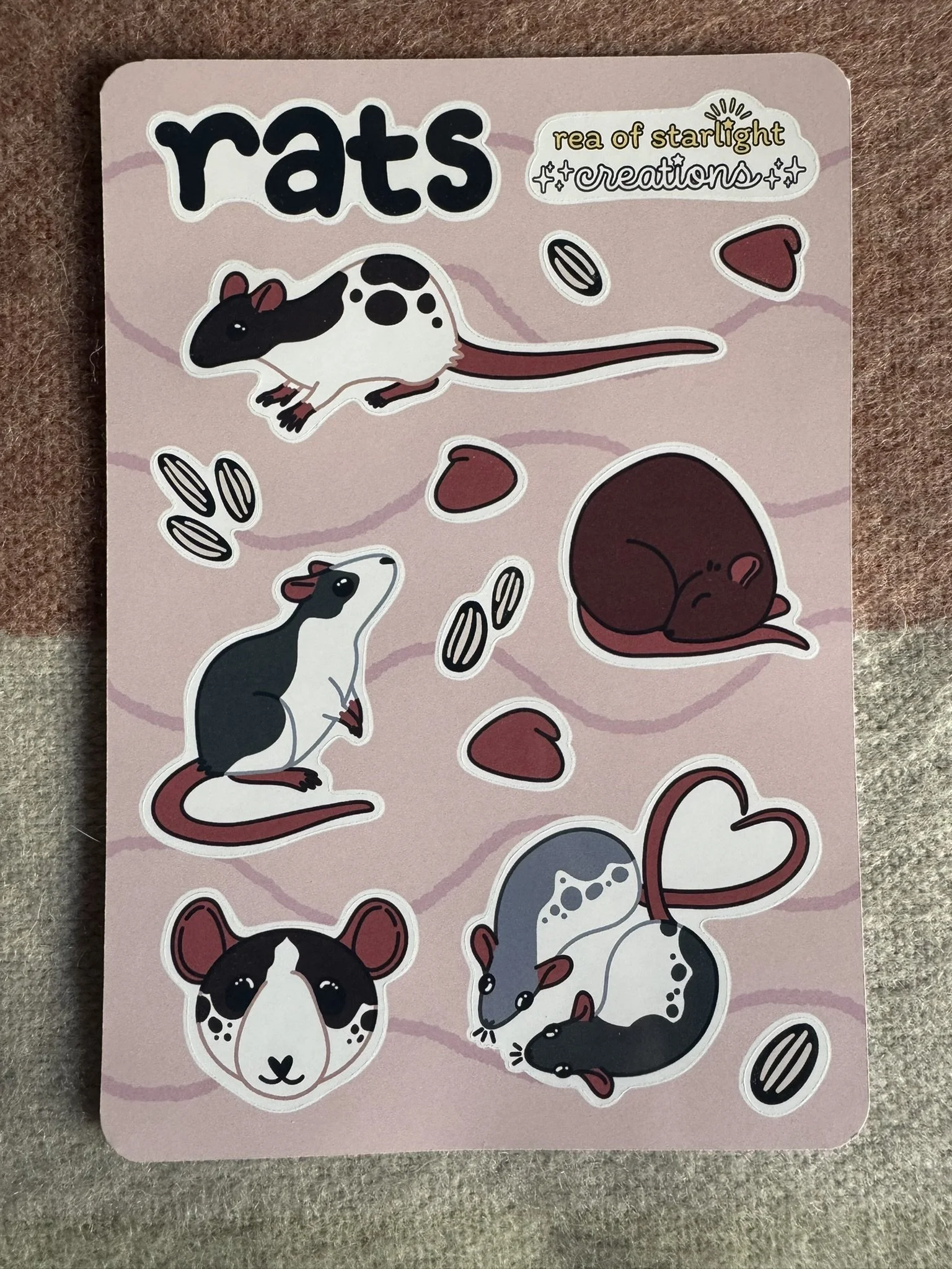 A glossy sticker sheet featuring rats, sunflower seeds, and yogurt bite snacks.