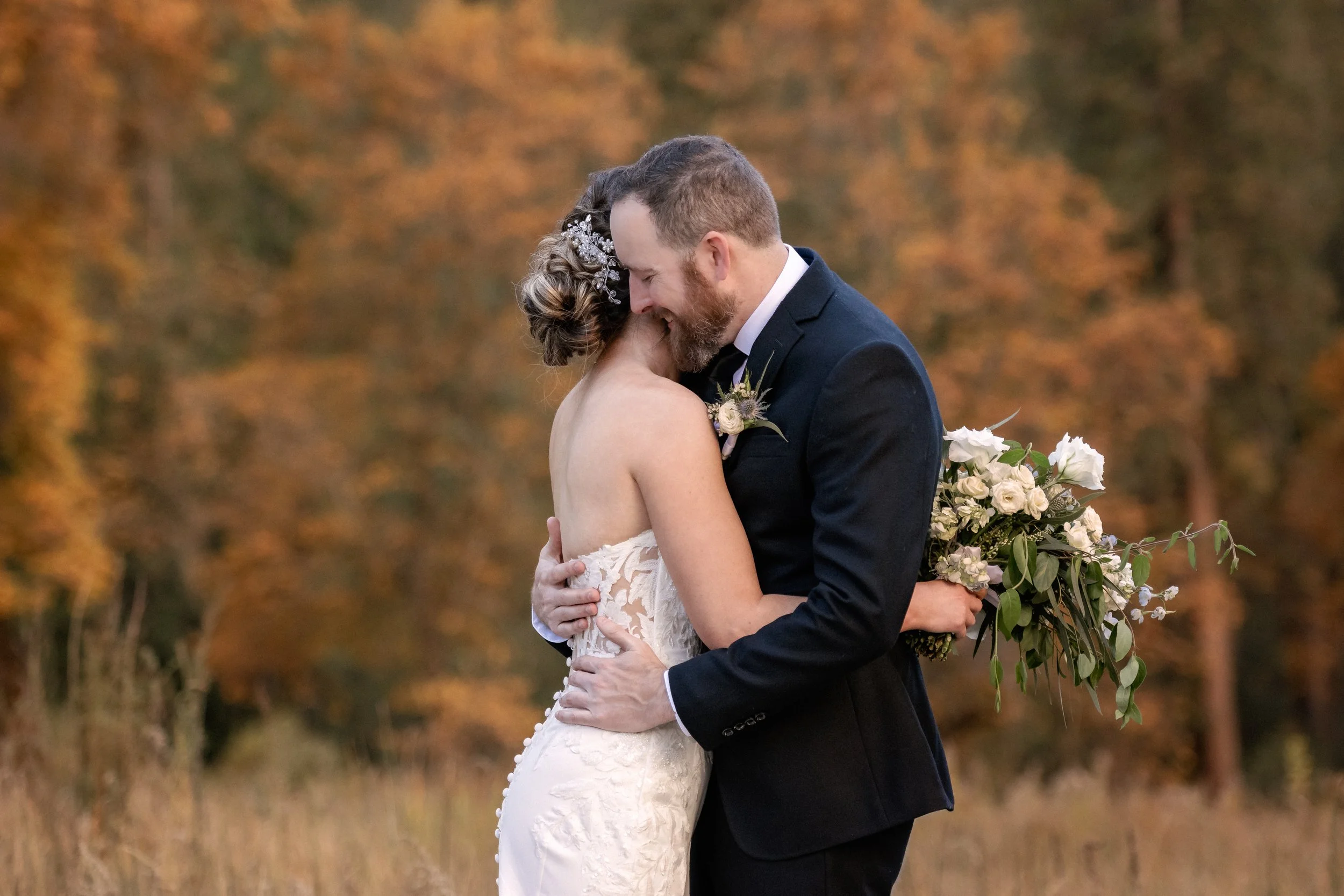 Bride and groom in an embrace in Yosemite