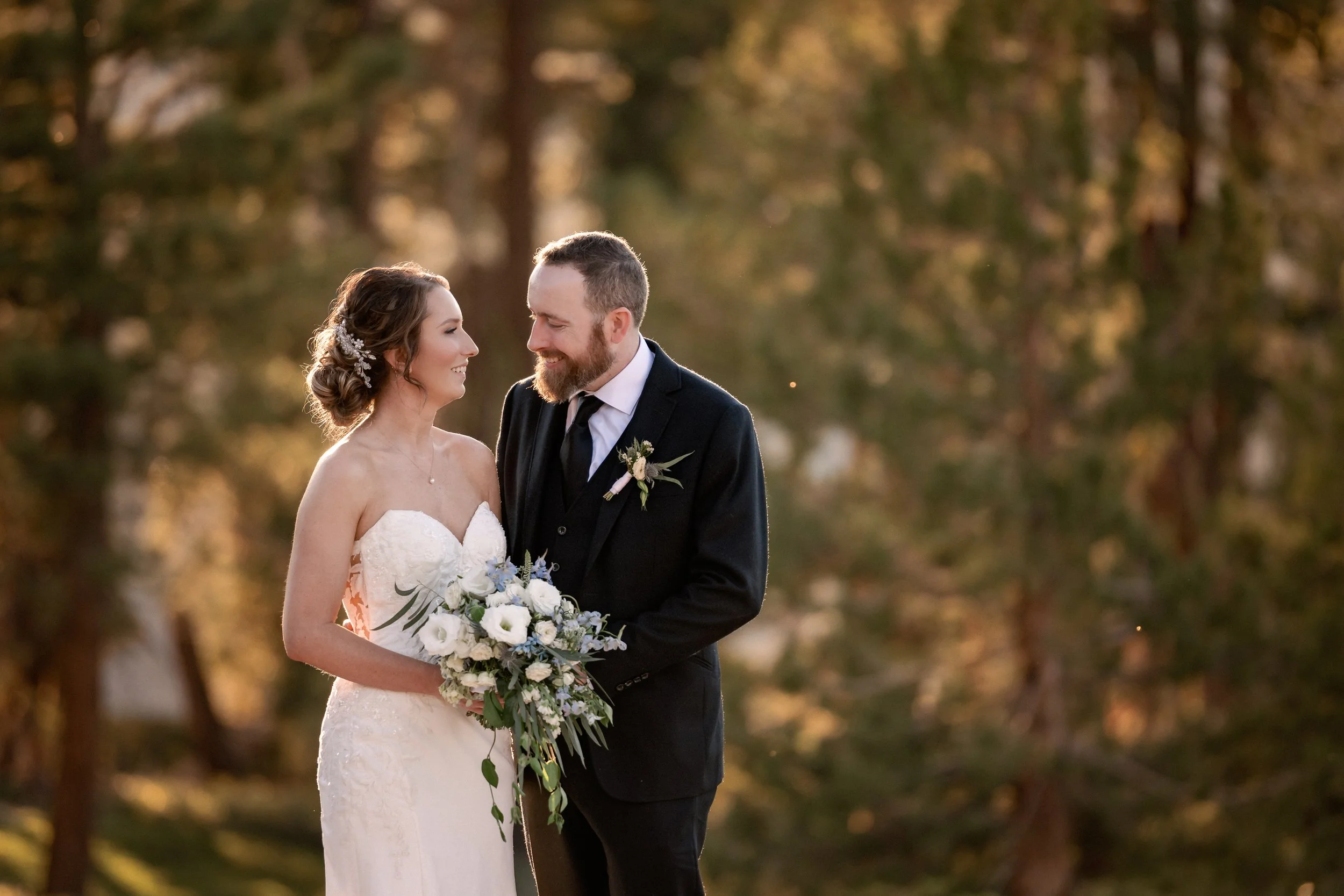 Bride and groom having an intimate moment in Yosemite