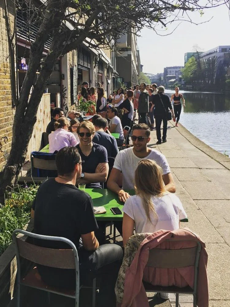 people-having-lunch-along-a-canal.jpg