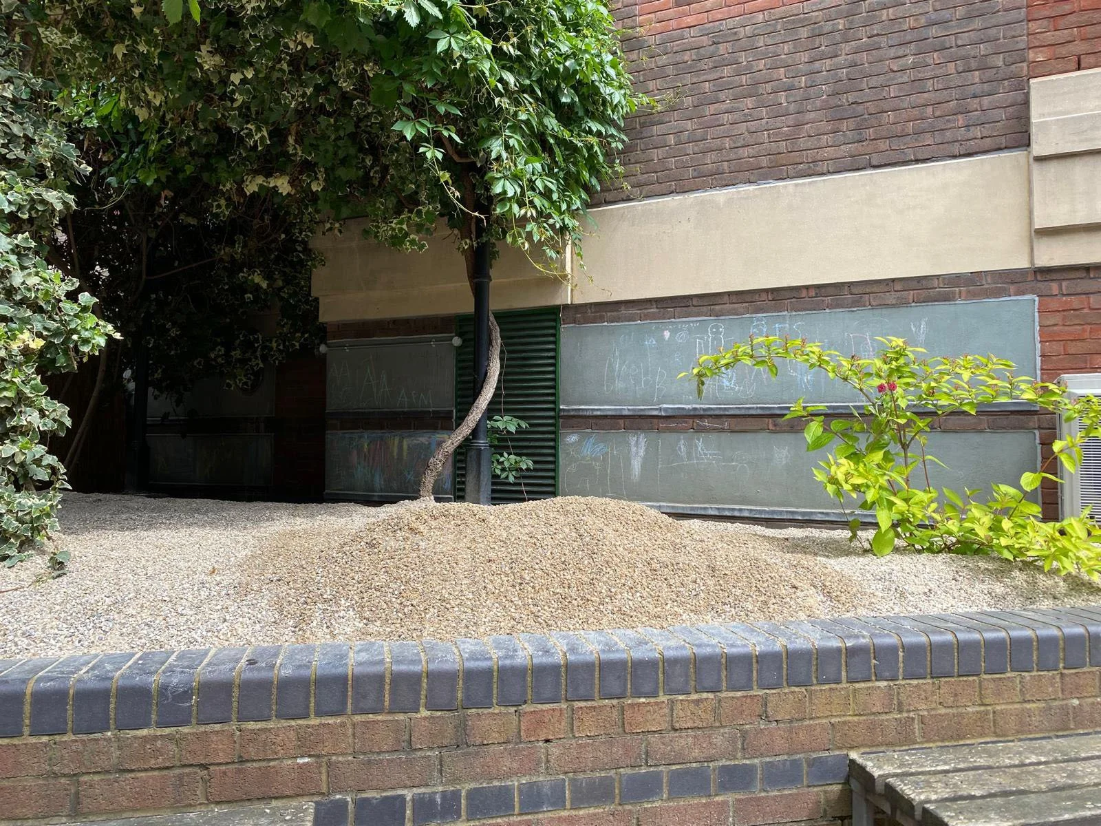 Experimenting with mounding sand to provide more interest, as directed by Peter Korn