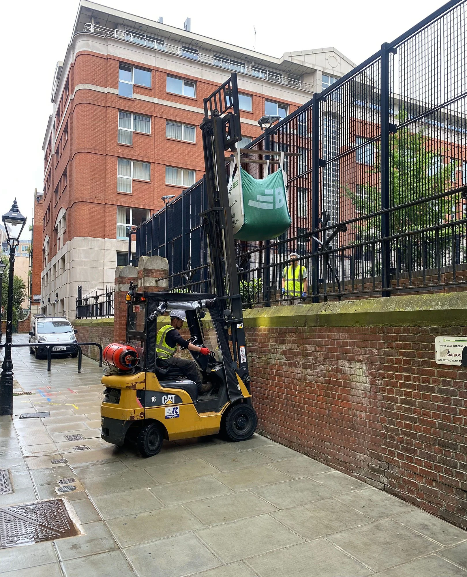 16th May 2024 - pouring sand directly in behind the ball court by carefully scoring incisions into the undersides of the bags