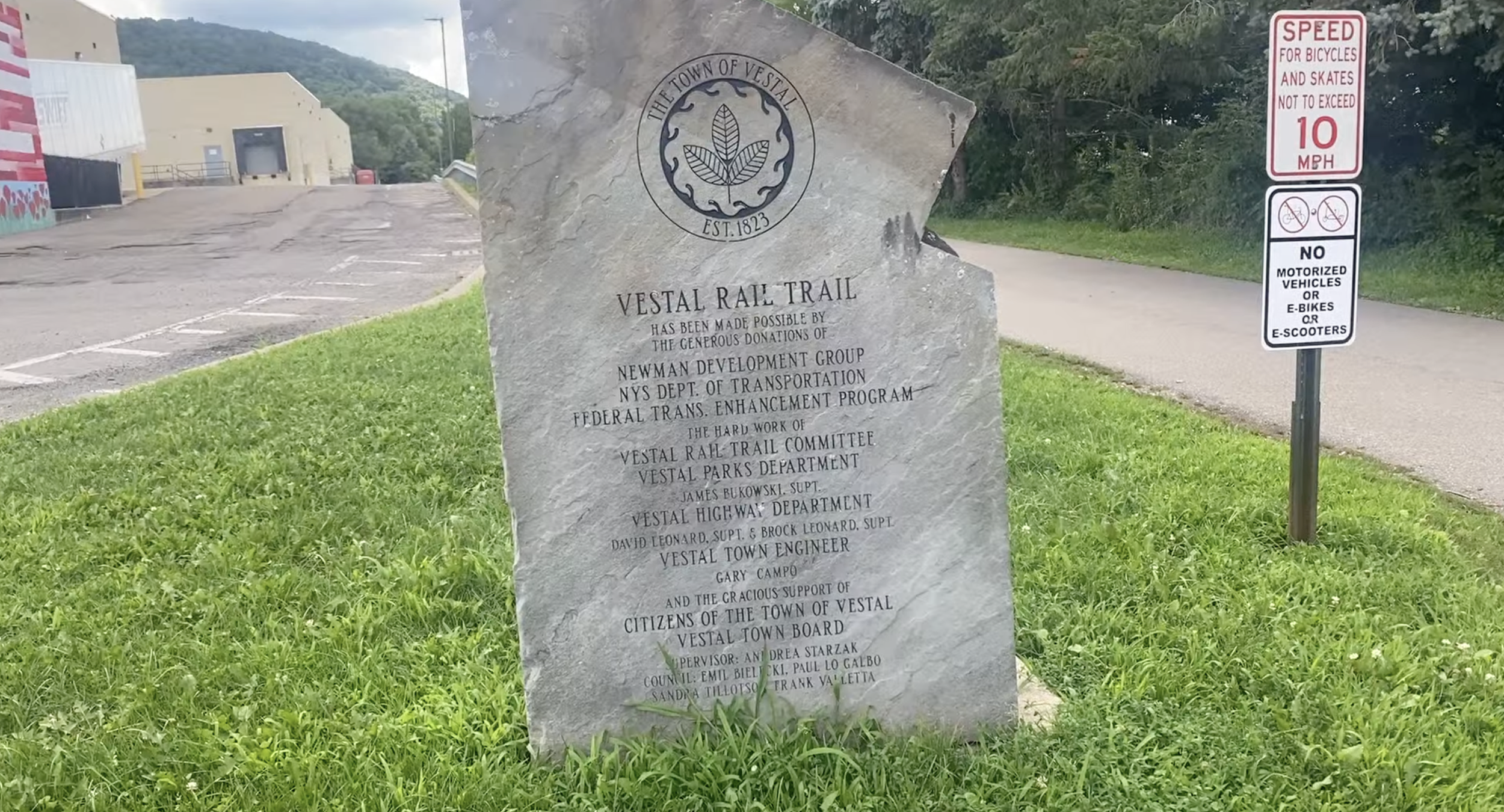 Stone sign for the rail trail.