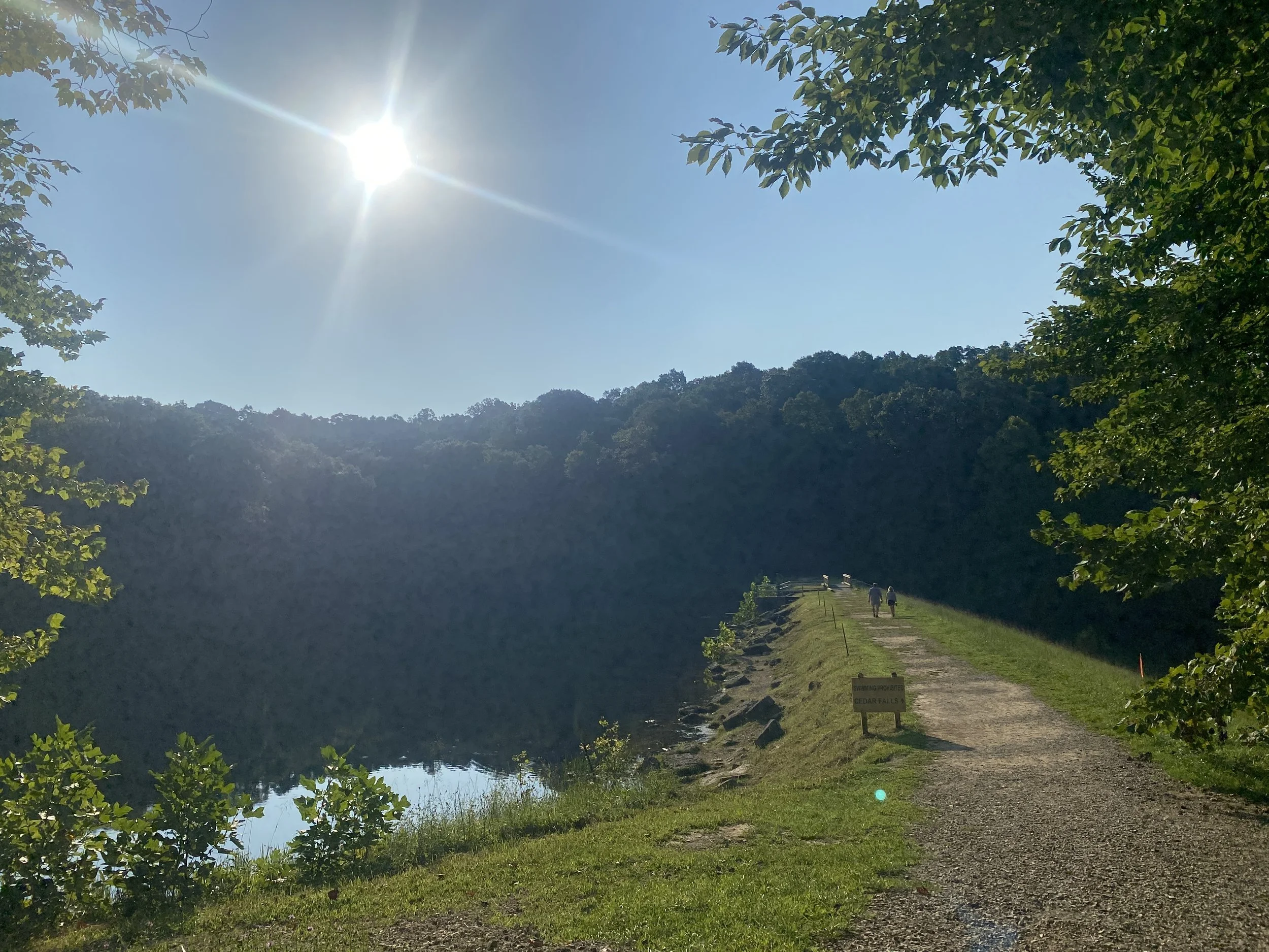 A pathway leading along a popular fishing section of the path. The lake is off to the left