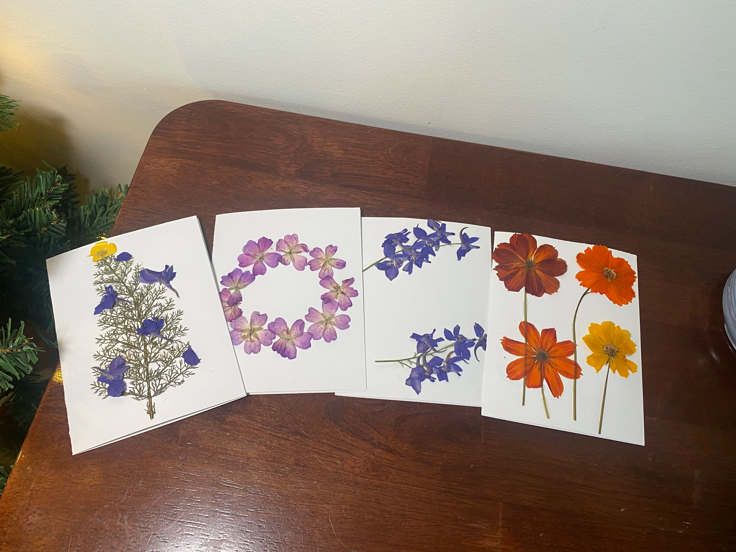 Handmade cards with pressed flowers on the front.