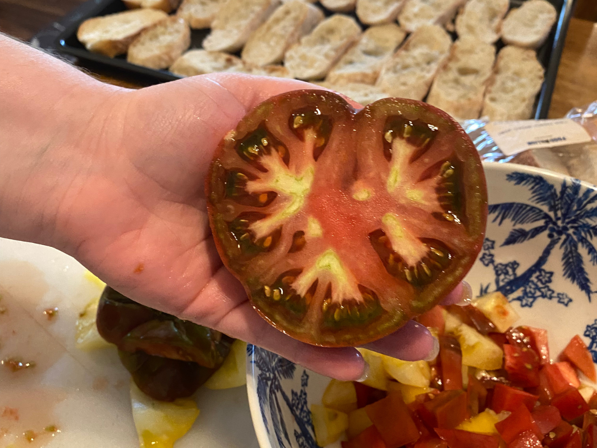 Cherokee purple tomato cut in half.