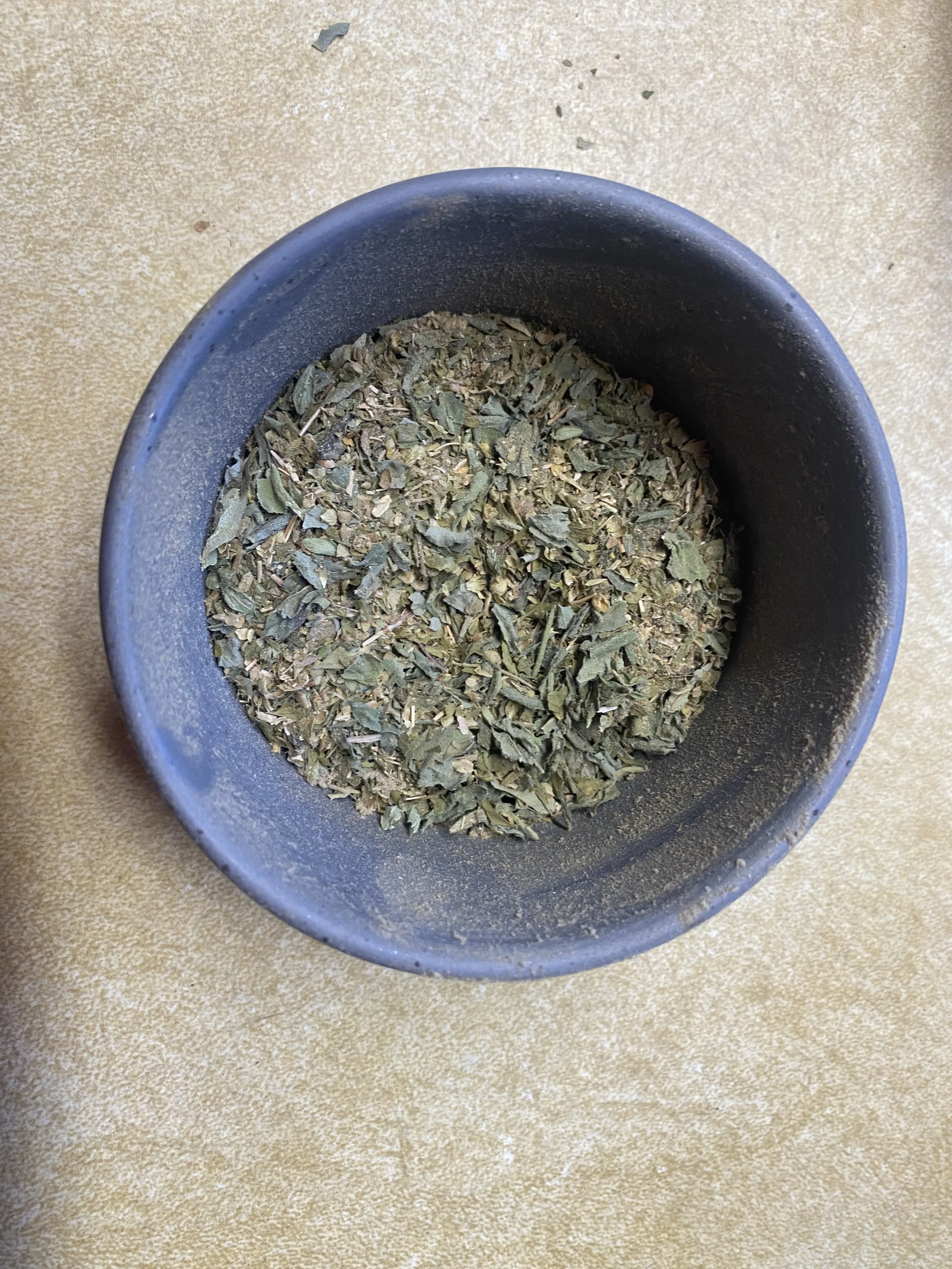 Ramekin with italian seasoning blend.