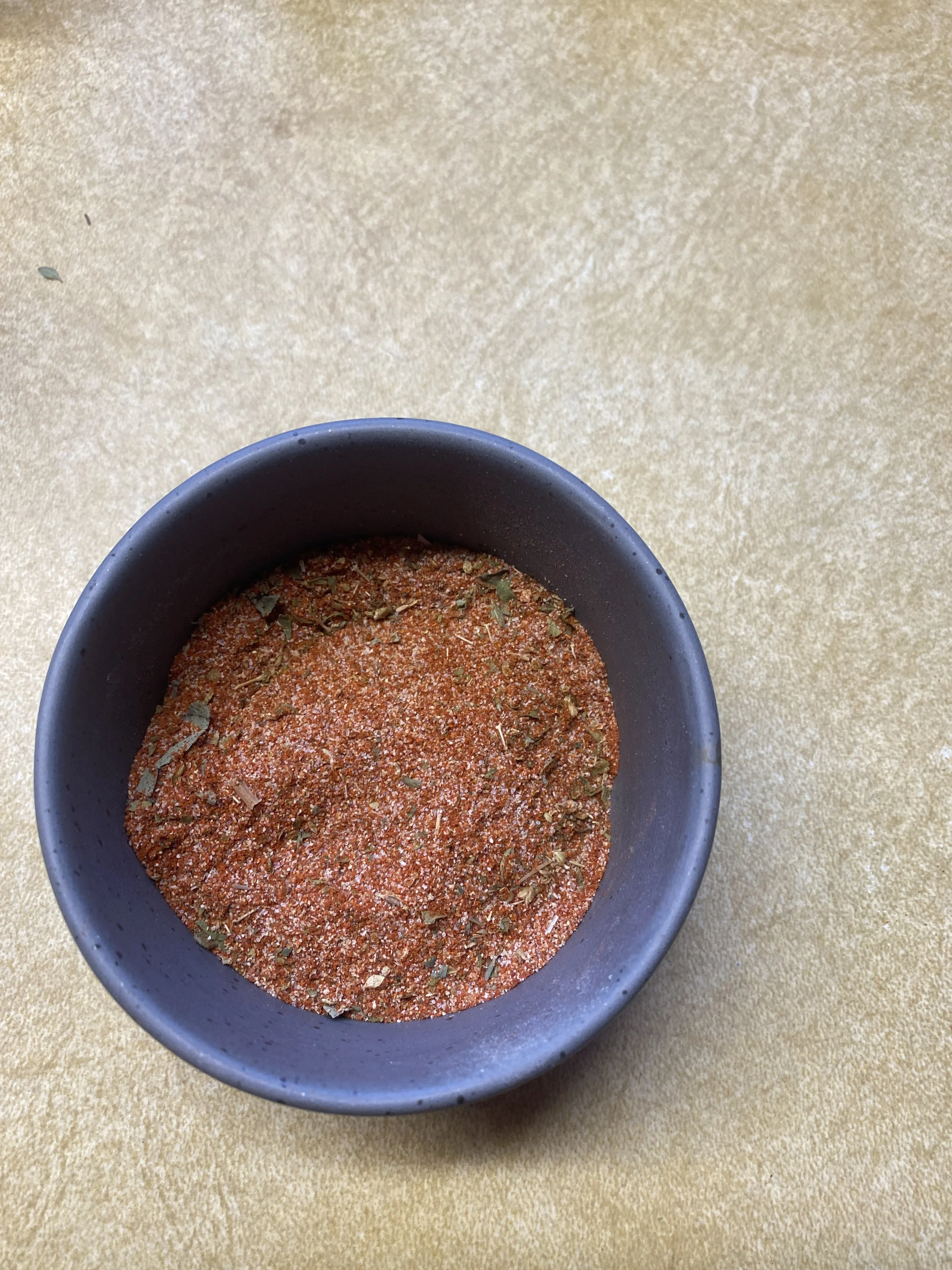 Ramekin with cajun seasoning blend.