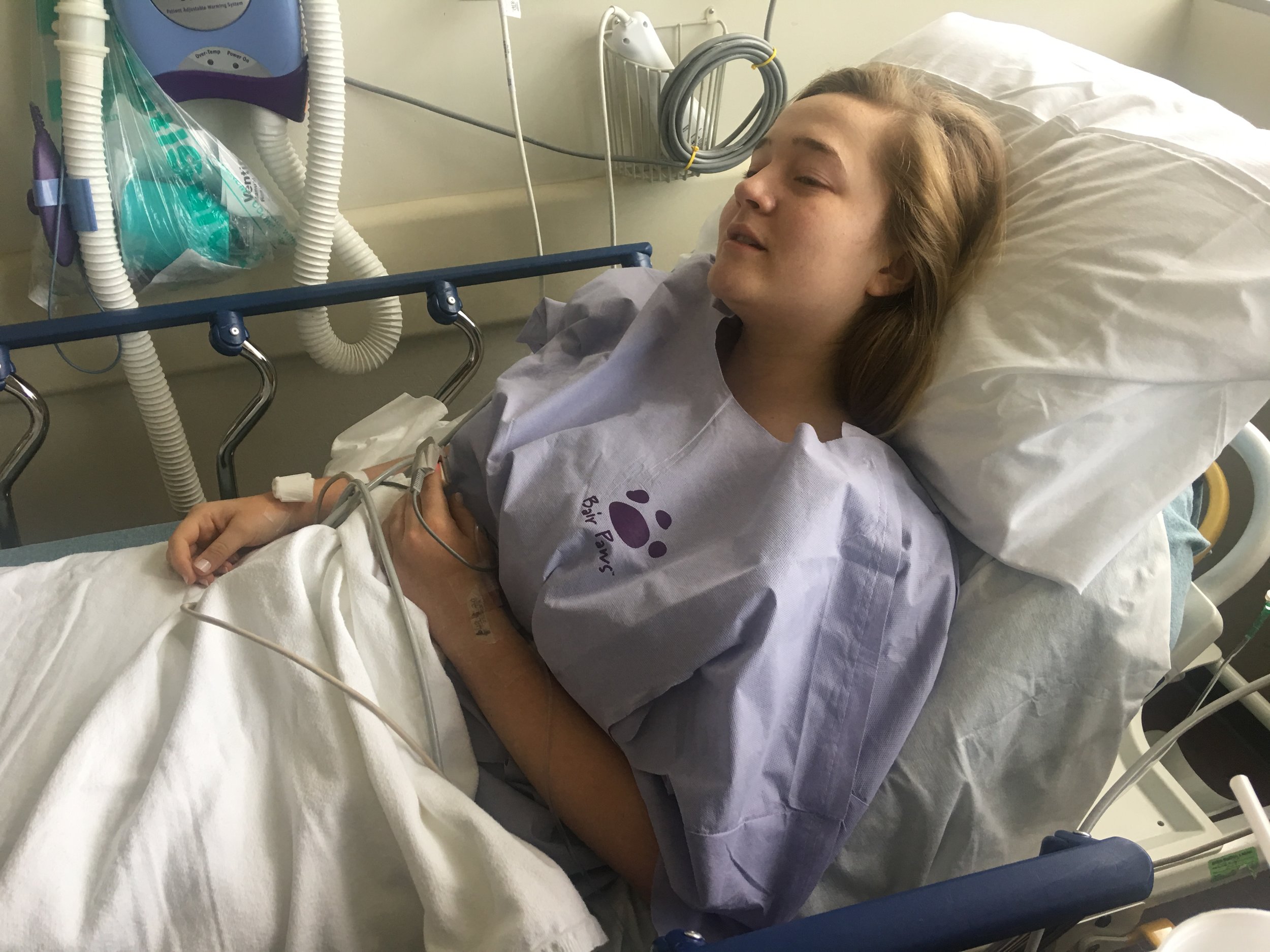  After surgery, which lasted just a about 2 hours, we were brought back to her room for recovery. &nbsp;Last time she was so sick afterwards. We were really worried she was going to have a rough time again. &nbsp;They gave her some crackers and we wa