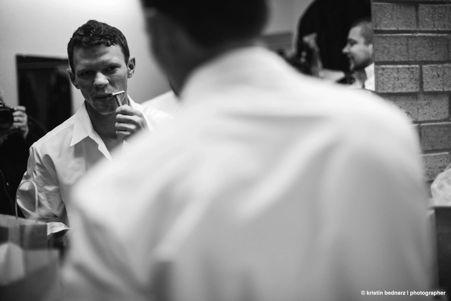  Okay, this is black and white, so you can’t see the blood, but who shaves at the church ON THE WEDDING DAY?  Well, Bradley, that’s who.   