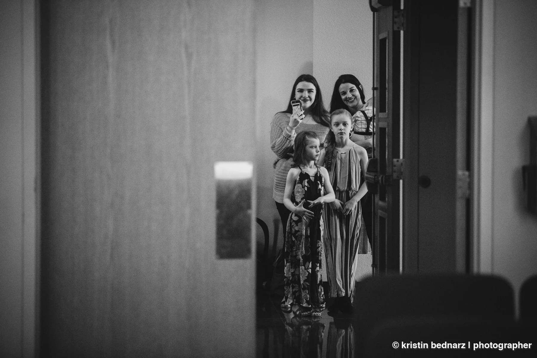  The family in the hallway watching.  On the left is Cole’s sister.  On the right, Karsi’s.   