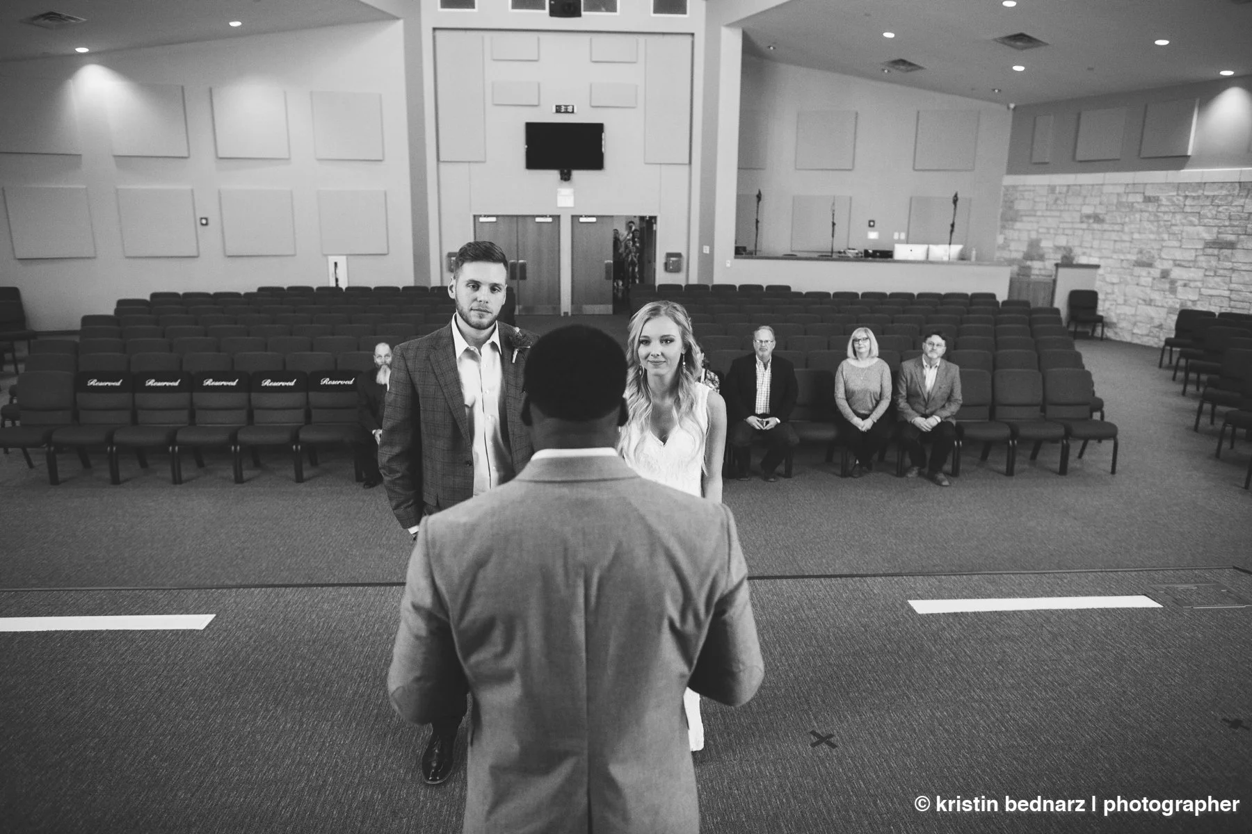  One of my favorite ceremony pictures ever!  Normally, I’m pushed up against a wall, a baptismal font, perhaps a huge flower display.  Not in this case.  I stuck my camera on silent mode and clicked away, holding it above my head until I was sure I h