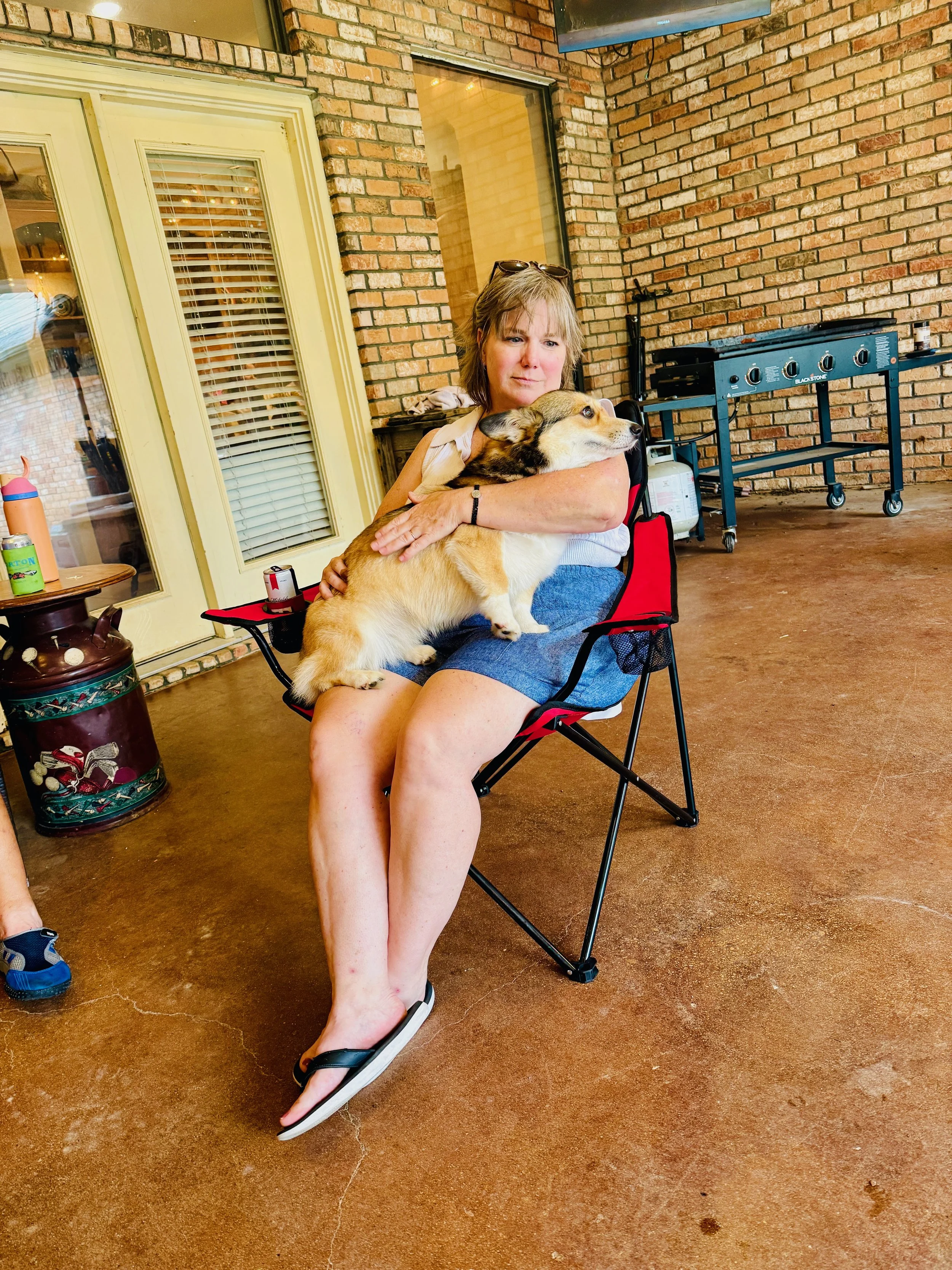  We spent lots of time on this patio this weekend.  This is Bridgette loving on her pup.   
