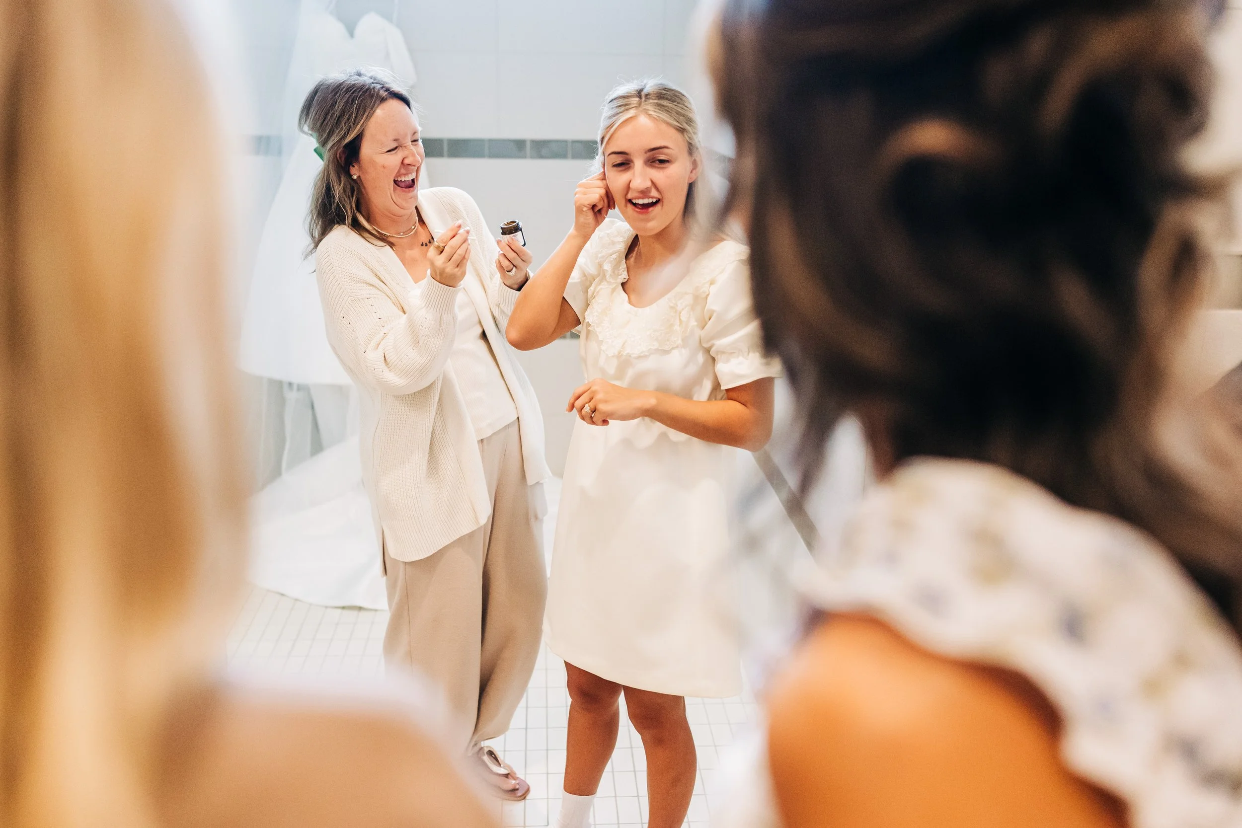  Jaycie and her mom were sharing a moment here.  Something about an earring hole and needing a little help or maybe an ear zit, which I realize is not a very bridal thing to say on a wedding blog, but hey!  Zits happen.   