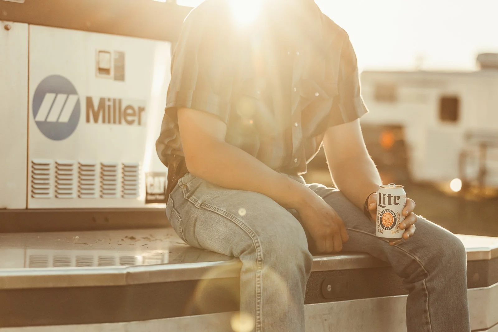 cowboy with a miller lite at goshen stampede rodeo