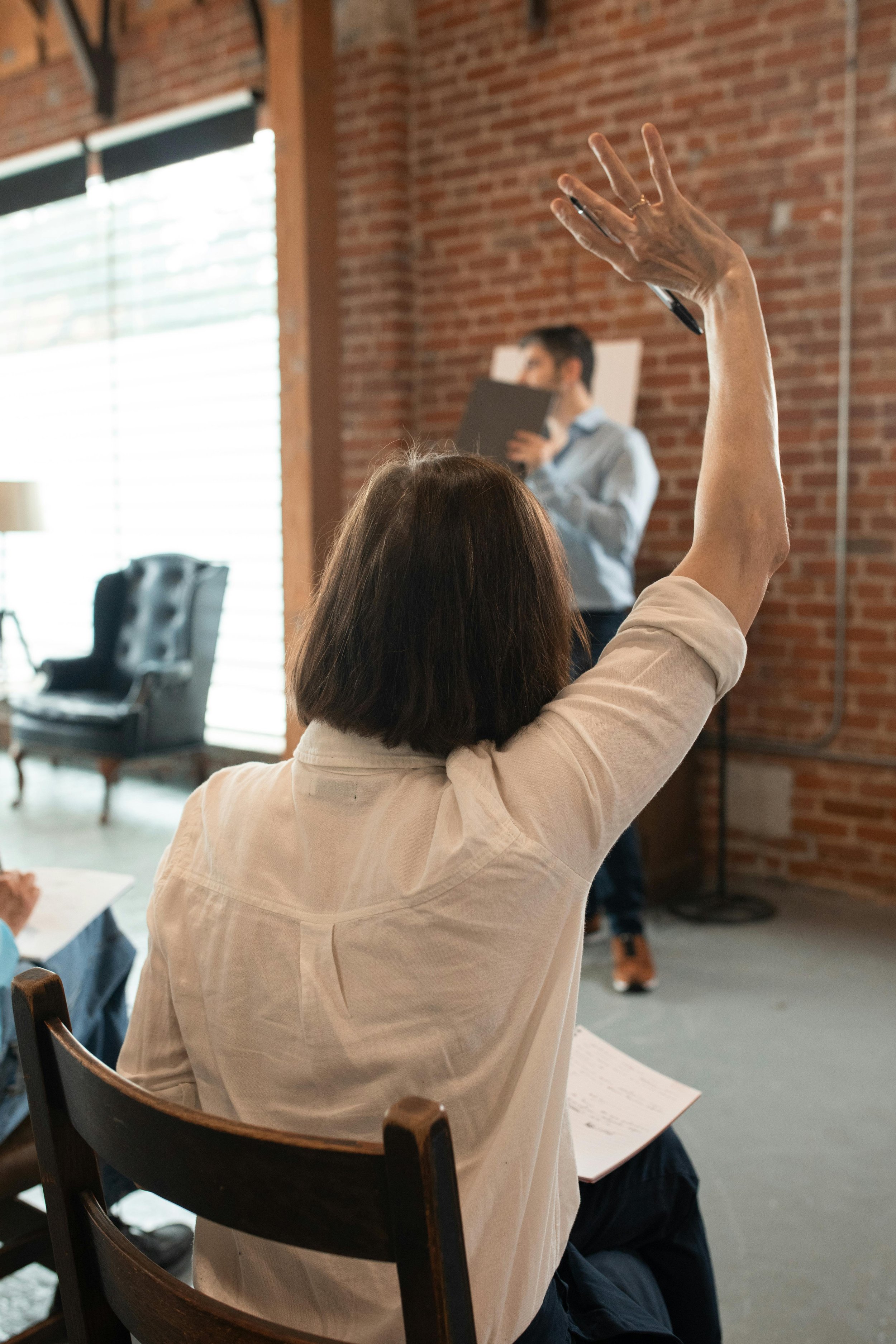 Woman with raised hand