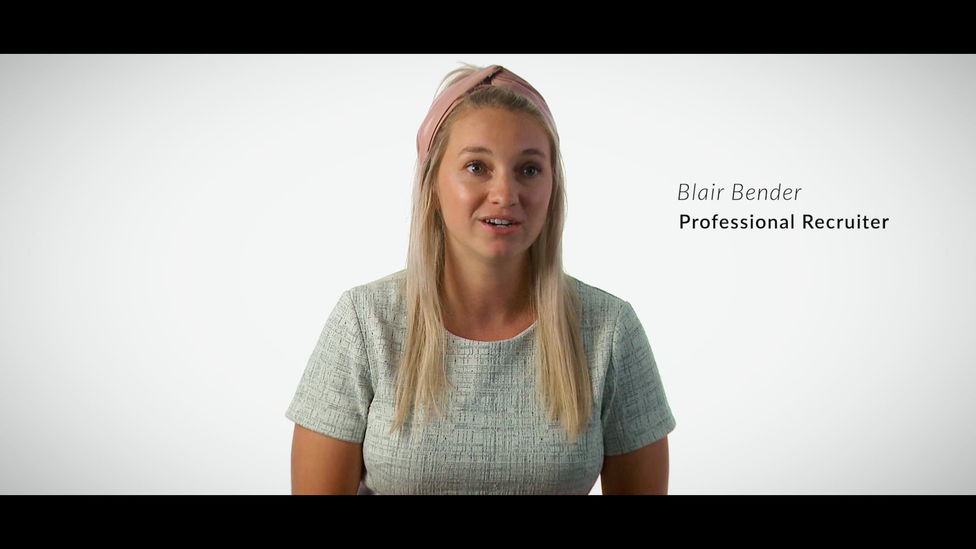 A woman with long blonde hair wearing a pink headband and a light gray top, speaking in front of a plain white background, with text indicating her name as Blair Bender and her profession as a professional recruiter.