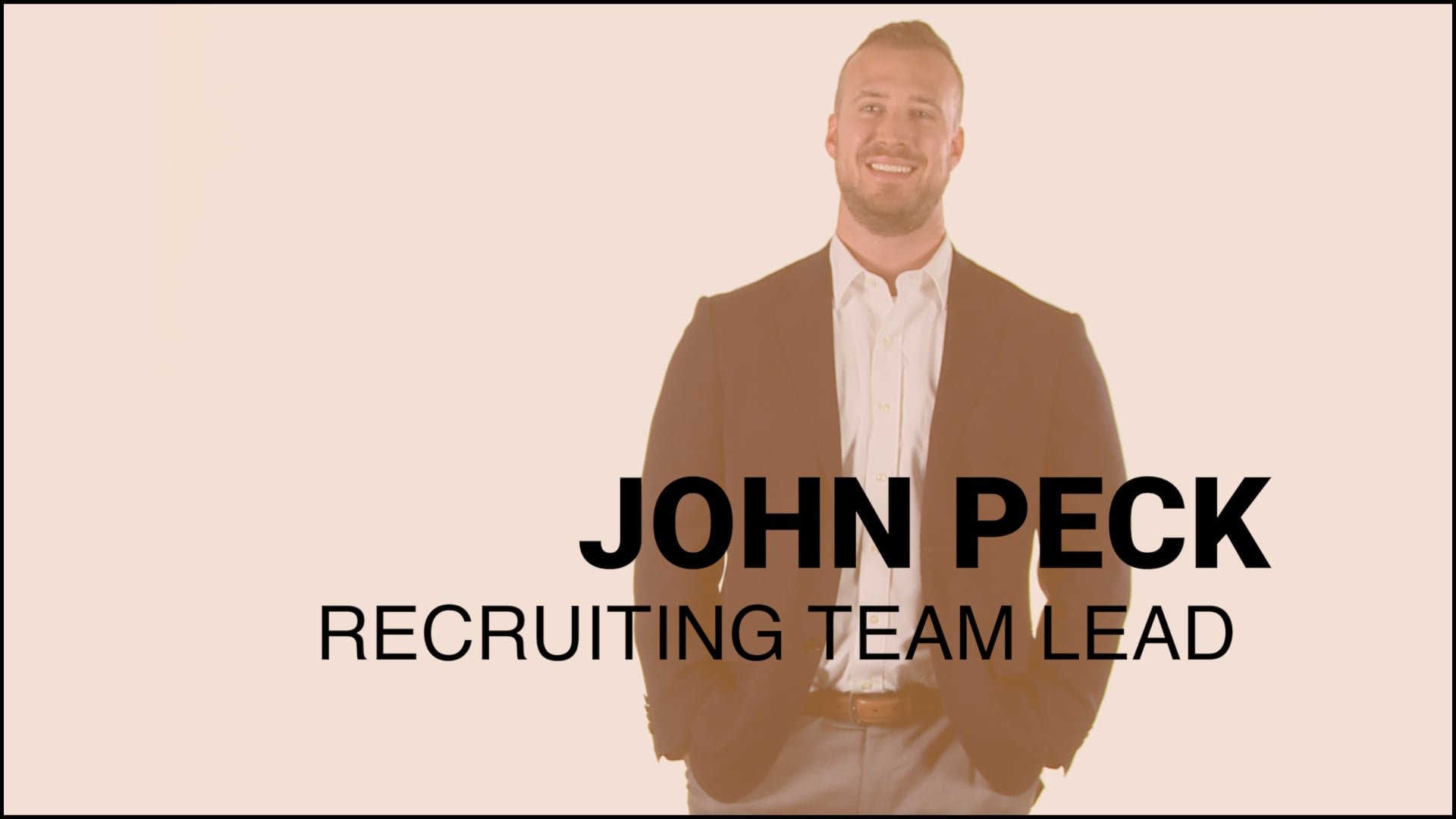 A man in a suit standing confidently with text overlay that reads "John Peck, Recruiting Team Lead".