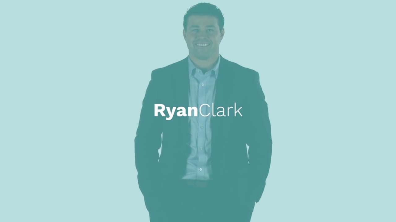 A man in a suit smiling with the text 'Ryan Clark' overlaid.