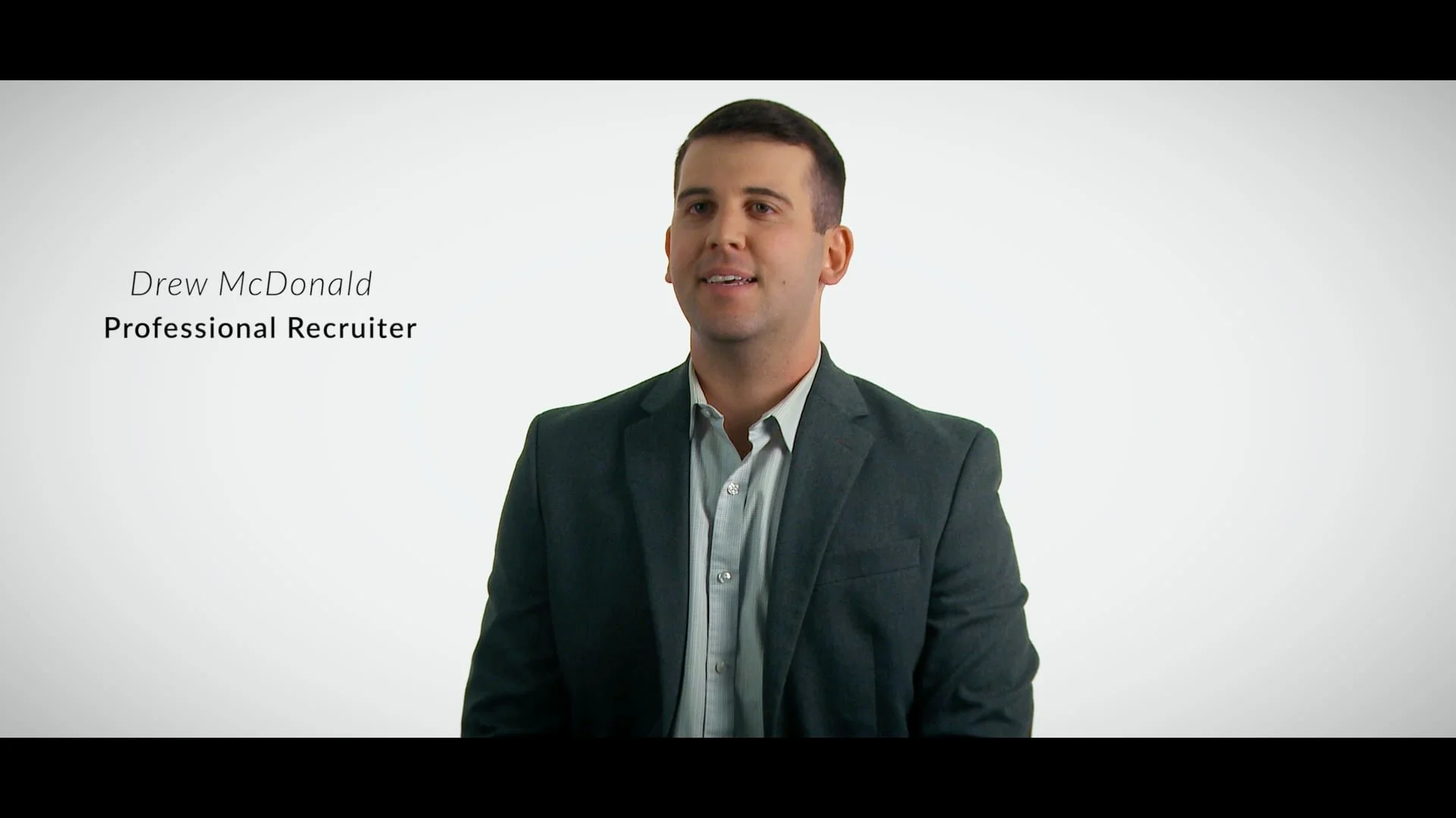 Image of Drew McDonald, a professional recruiter, speaking in a presentation or video.