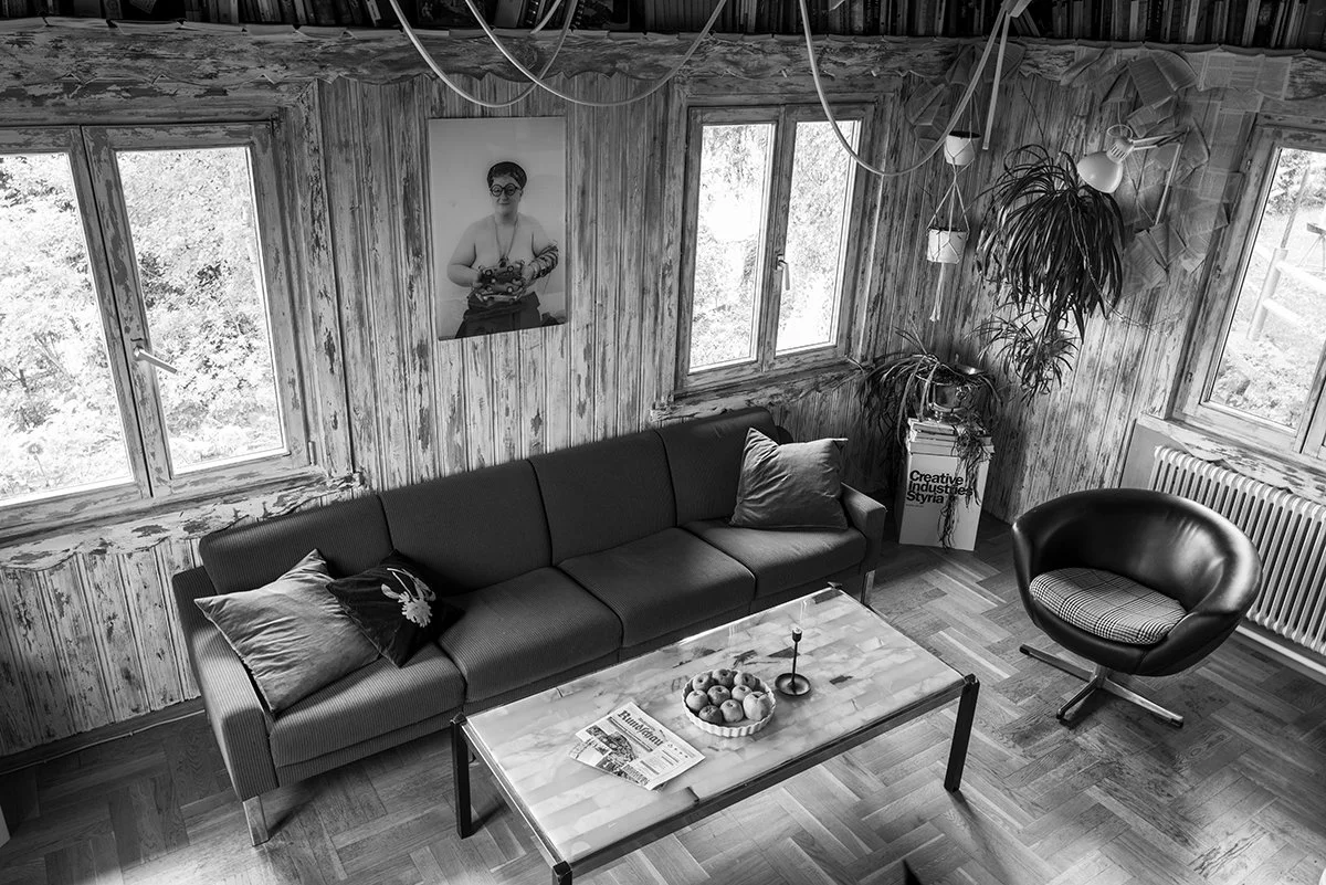 Interior design and vintage furniture at Absteige Zur Bärtigen Therese, the first queer hotel in Austria, showcasing a unique alternative and lesbian travel destination.