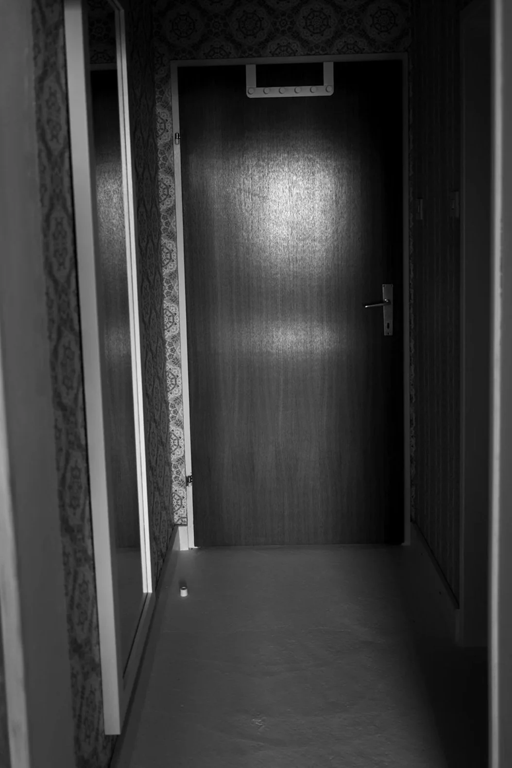 Interior design and vintage furniture at Absteige Zur Bärtigen Therese, the first queer hotel in Austria, showcasing a unique alternative and lesbian travel destination.