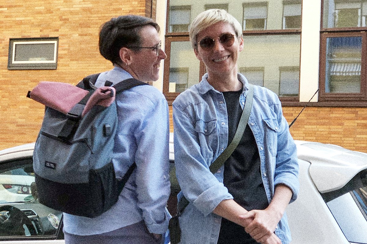 Two lesbian women, Julia and Alina, having drinks outside a gay bar in Frankfurt, Germany.