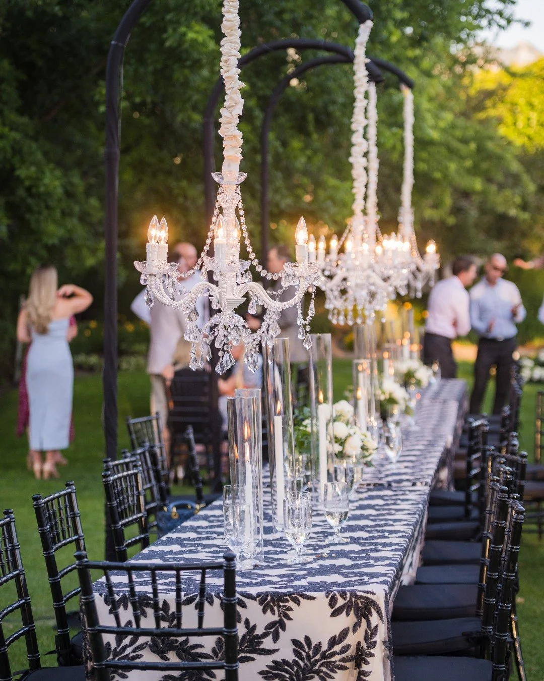 Tucked beneath a canopy of trees, this chandelier glows like a quiet invitation to celebrate something timeless.

Guests were welcomed with live-painted portraits, such a heartfelt touch, and the sweetest treats to end the evening on a high. A beauti