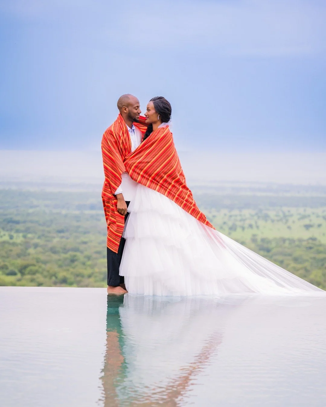Wrapped in a kanga, rich with heritage and meaning, Judica + Charles stood together in striking contrast to her modern gown. It&rsquo;s tradition layered gently over contemporary elegance. The result felt effortless and deeply intentional, honoring c