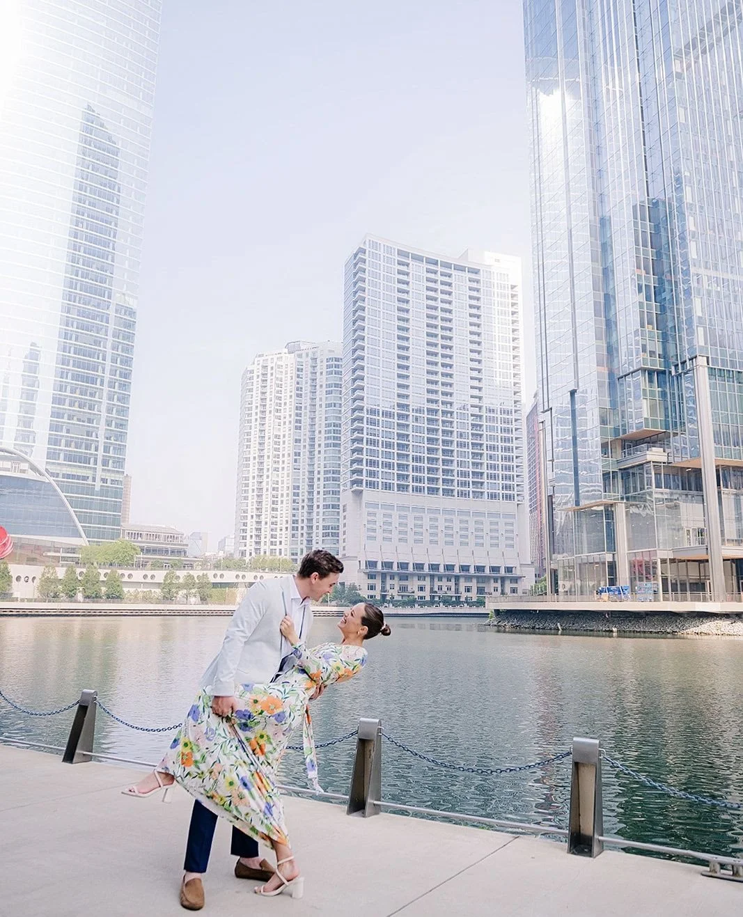 Some places become part of the story.⁠
⁠
Between the glass skyline and the still water, these two found a quiet moment that felt entirely their own. No elaborate posing. No rush. Just genuine laughter, soft glances, and the kind of connection that ma